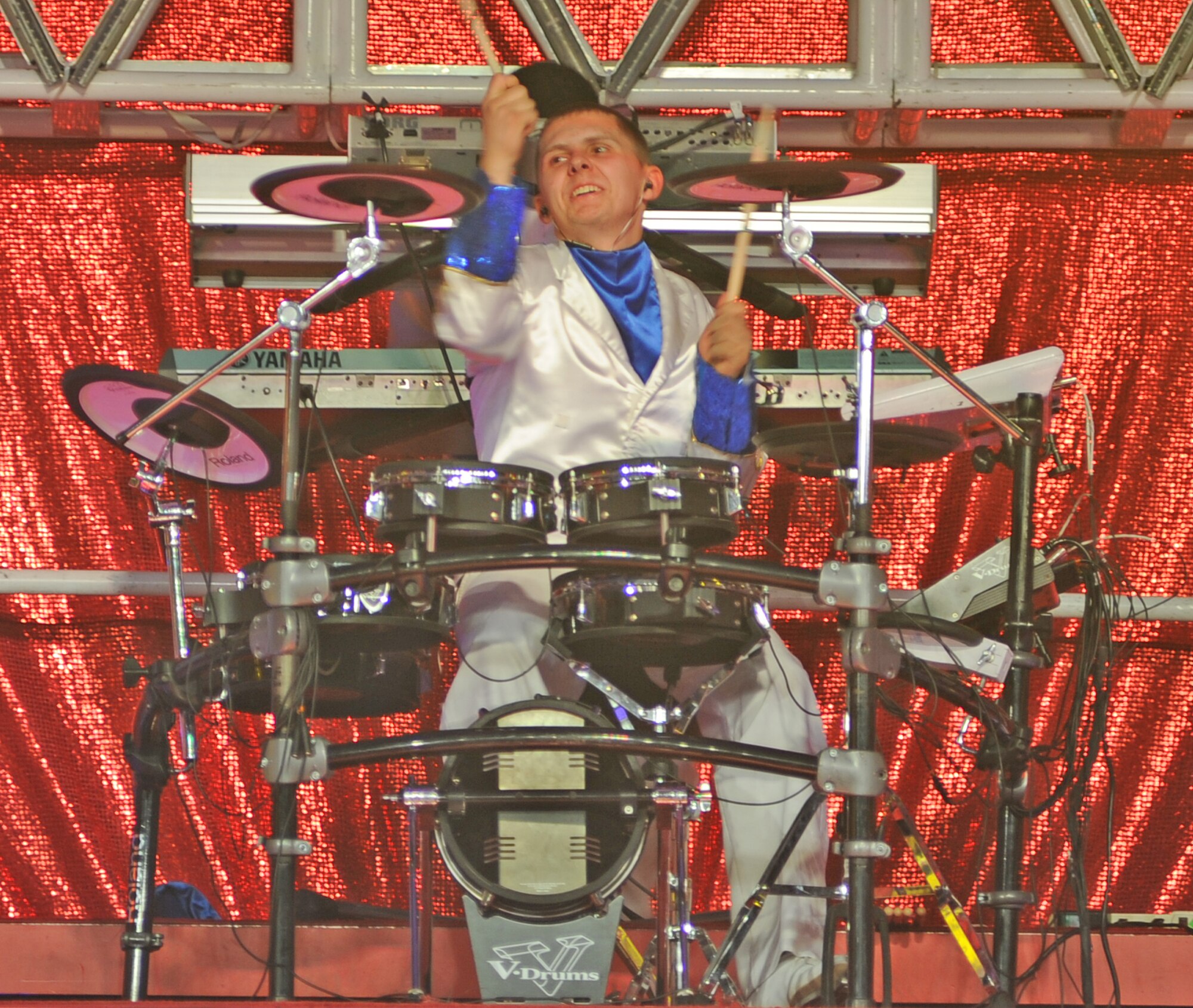 U.S. Air Force Airman 1st Class Maxwell Hulett plays the drums during a Tops in Blue musical showcase at Seymour Johnson Air Force Base, N.C., Jan. 27, 2012. Tops in Blue is an expeditionary entertainment unit that performs musical shows in 20 different countries. Hulett is assigned to the 4th Aircraft Maintenance Squadron Avionics Flight and hails from Richmond, N.H. (U.S. Air Force photo/Senior Airman Gino Reyes/Released)