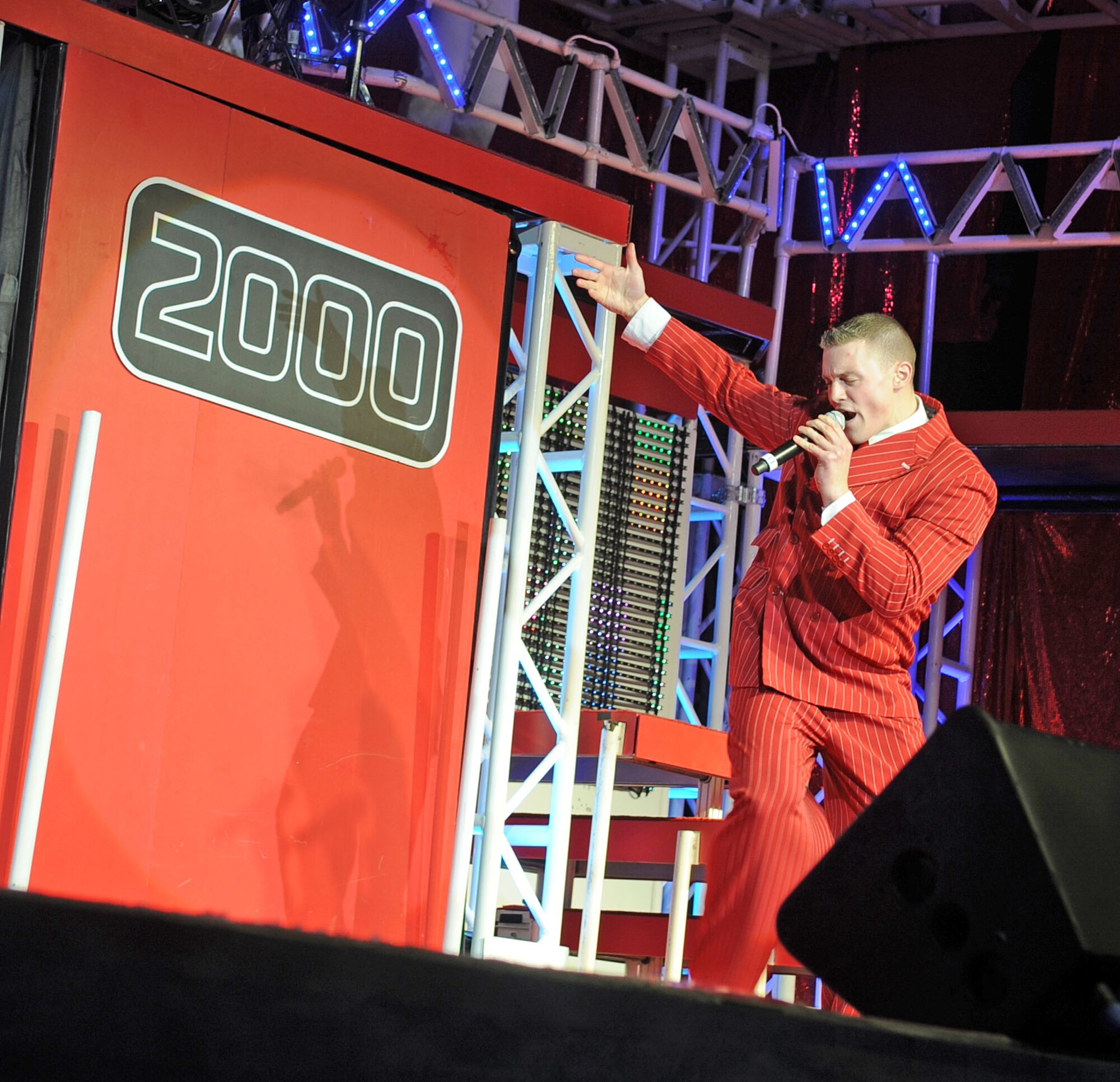 U.S. Air Force 1st Lt. Robert Doyle performs a solo during the Tops in Blue concert at Seymour Johnson Air Force Base, N.C., Jan. 27, 2012. Doyle is the Tops in Blue officer in charge and a vocalist. He hails from Avon Lake, Ohio. (U.S. Air Force photo/Senior Airman Gino Reyes/Released)