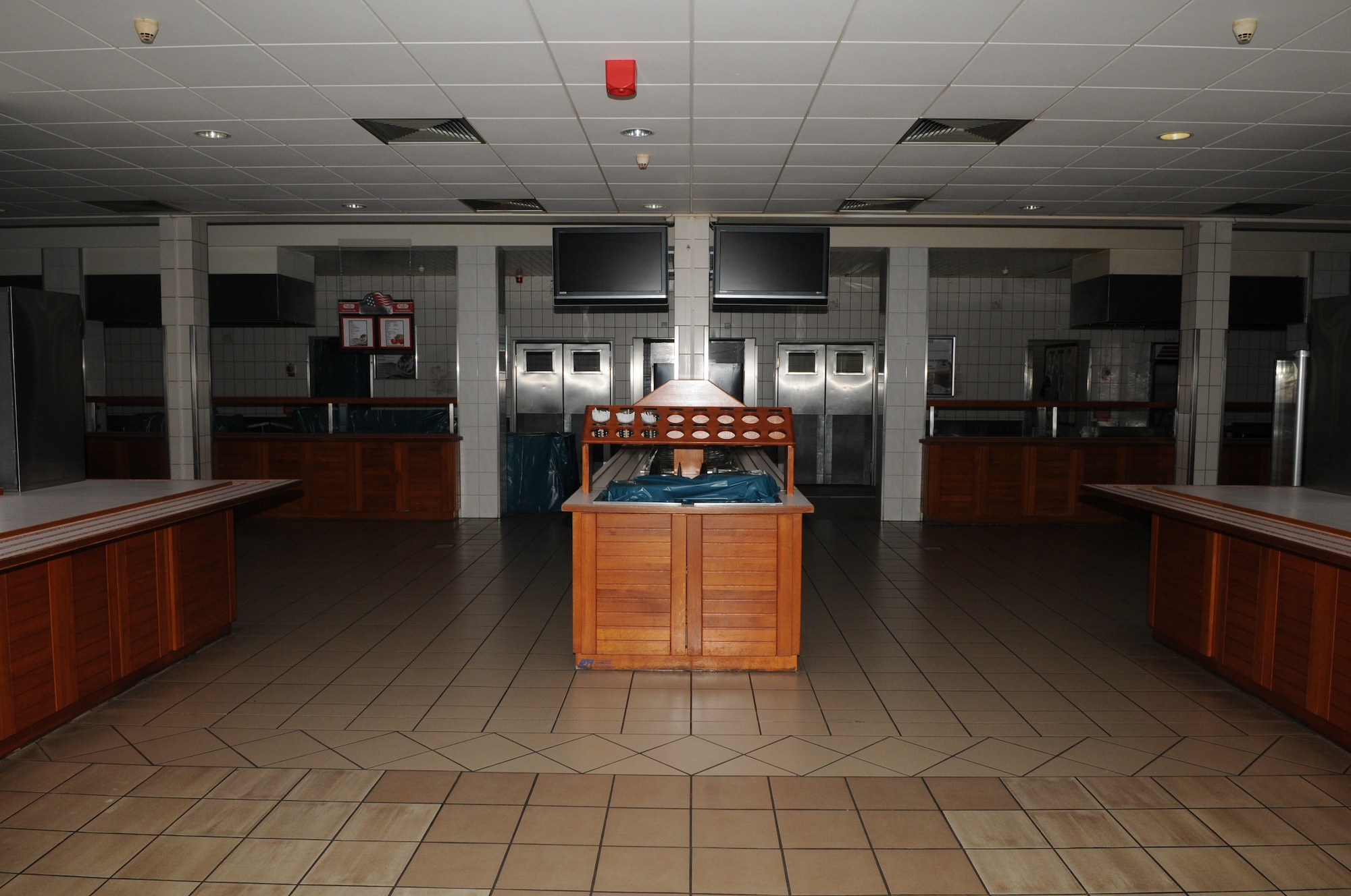 SPANGDAHLEM AIR BASE, Germany – The serving-line side and floor housing at the Mosel Dining Facility here was made of wood before the closure in August 2010. Moisture from day-to-day operations and mopping the tile floors caused some of the wood to chip and splinter. When the facility closed for renovations to the cold-storage space, base engineers used the closure time to upgrade the serving line, foot-traffic pattern and seating area. The serving line’s flooring is now stainless steel, and the new appearance is designed to make meal times more efficient for DFAC customers. (U.S. Air Force photo/Senior Airman Nick Wilson)