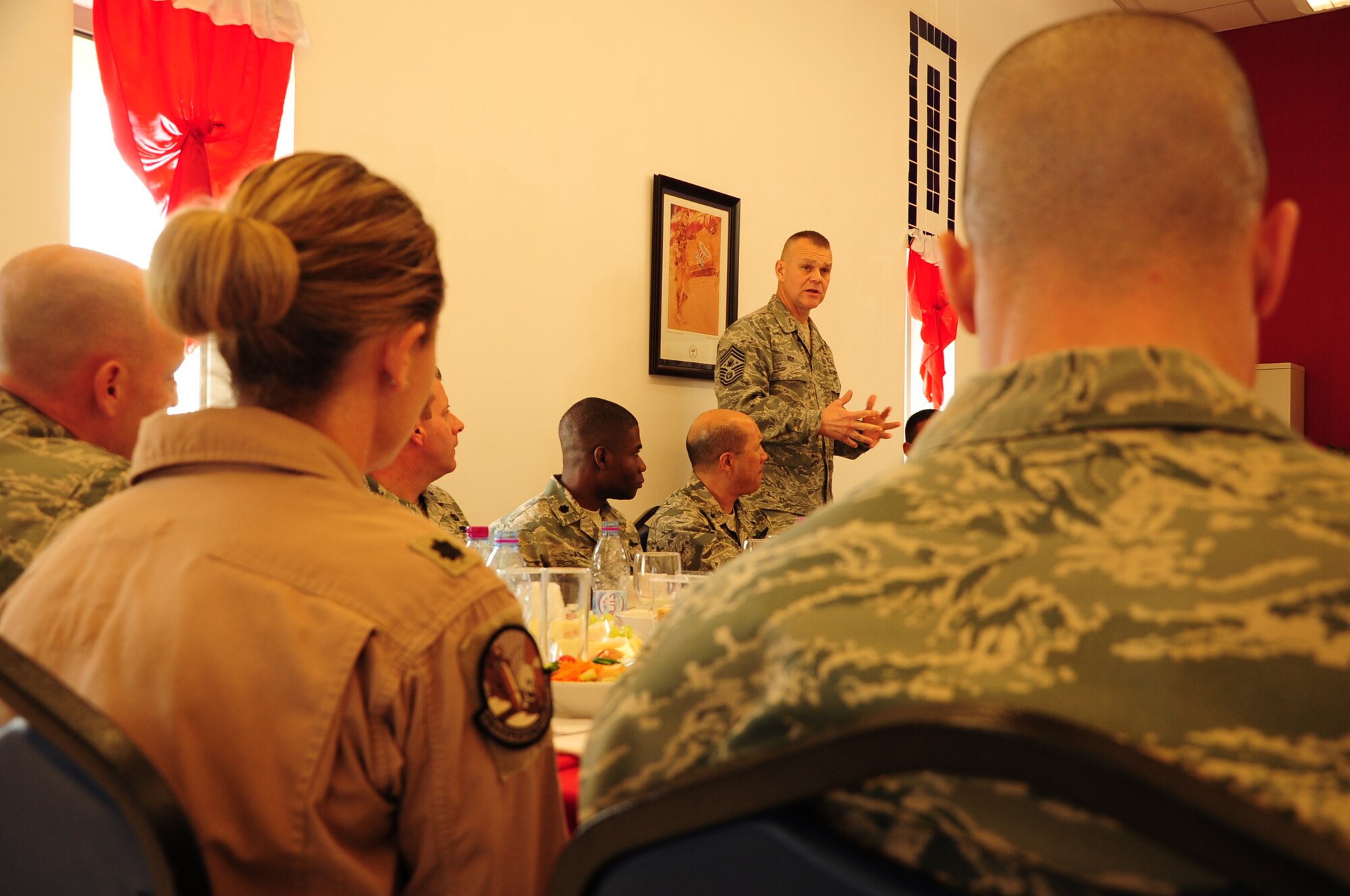 SOUTHWEST ASIA -- Chief Master Sgt. of the Air Force James Roy talks with 379th Air Expeditionary Wing squadron commanders and group chiefs during a luncheon at here Jan. 31, 2012. During the luncheon, Roy discussed and answered questions about the future of the Air Force. Roy’s visit marked the first stop on a tour of Southwest Asia. (U.S. Air Force photo/Senior Airman Michael Charles)
 
