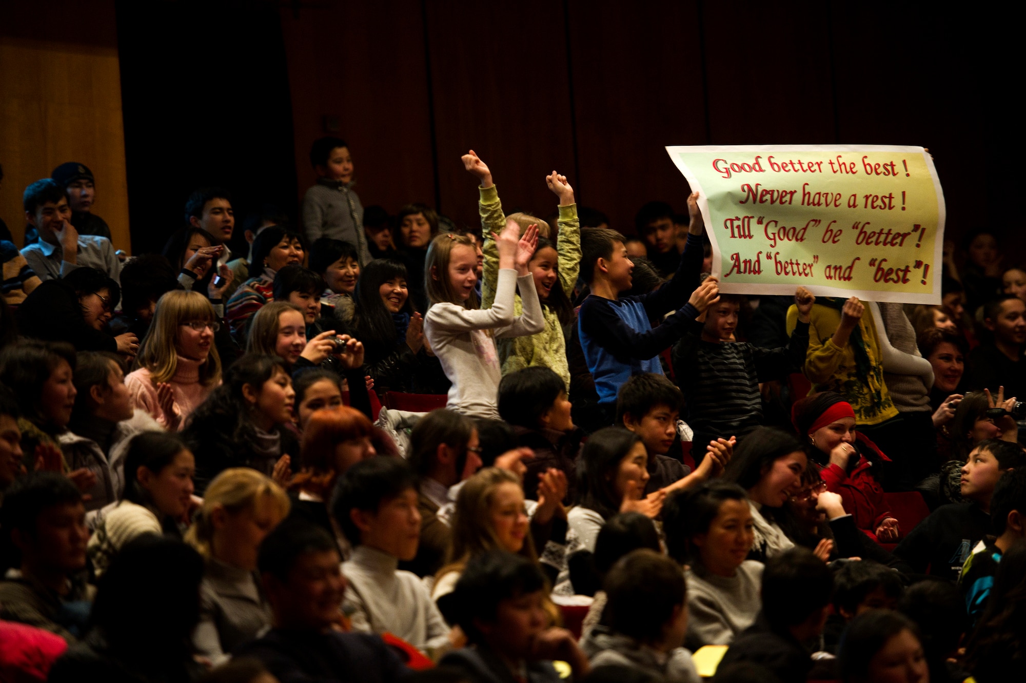 The crowd cheers for contestants during an American song contest at the Seitek Youth Center in Bishkek, Kyrgyzstan, Jan. 31, 2012. Children from schools in the surrounding area competed in the contest, which was sponsored by the U.S. Embassy. The event was a celebration honoring the 20-year friendship between the U.S. and Kyrgyz Republic. (U.S. Air Force photo/Staff Sgt. David Salanitri)