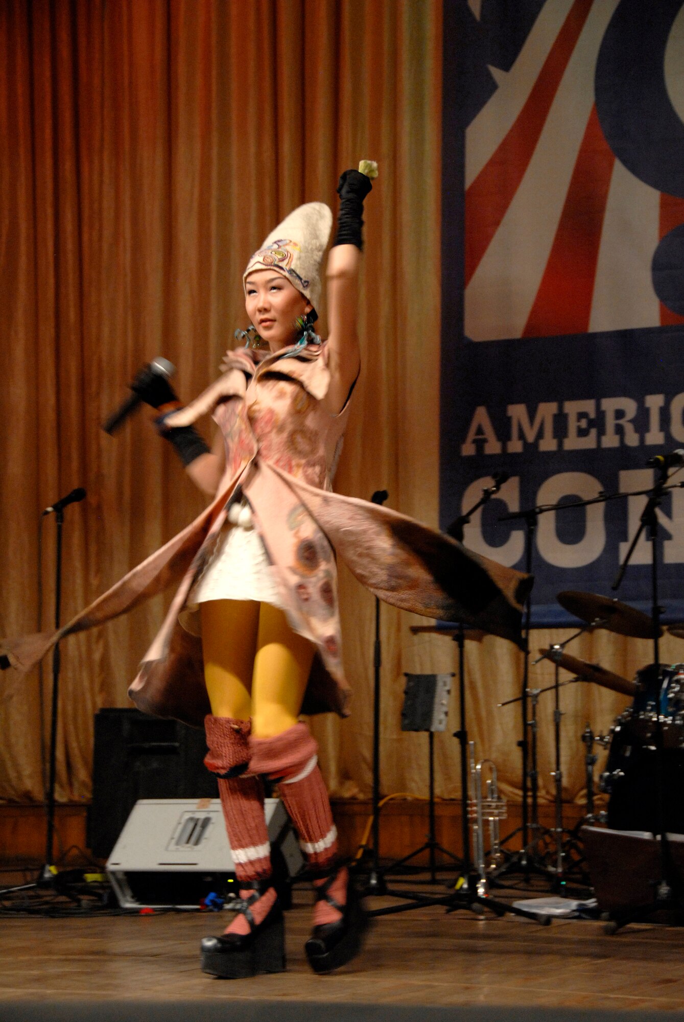 Kanykei, a local pop-rock sensation in Bishkek, Kyrgyzstan, performs ?Whenever, Wherever? by Shakira for a crowd of people at the Seitek Youth Center Jan. 31, 2012. Kanykei was a special guest during an American song contest sponsored by the U.S. Embassy to celebrate 20 years of friendship between the U.S. and Kyrgyz Republic. (U.S. Air Force photo/Senior Airman Lynsie Nichols)