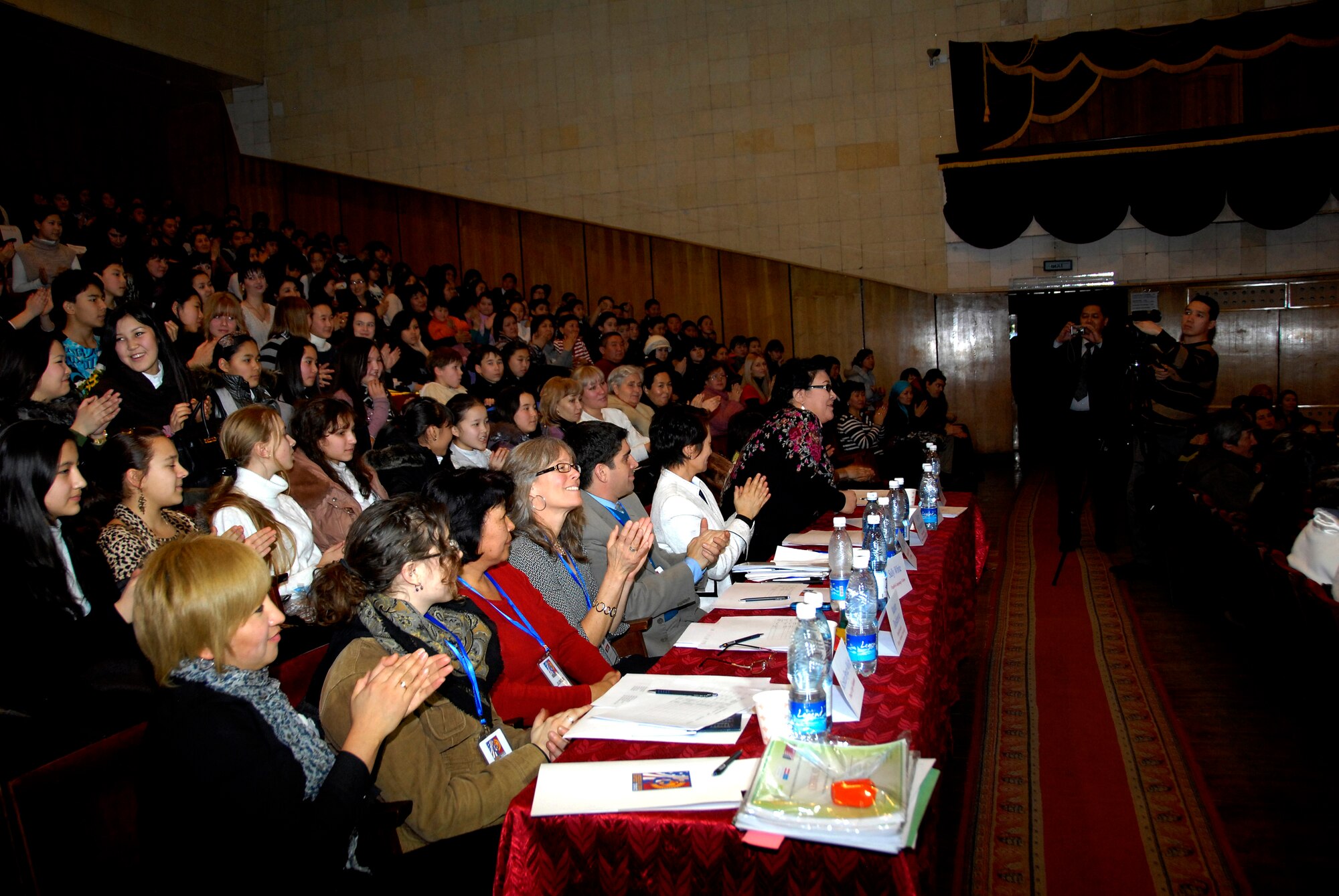 Judges watch a musical performance at the Seitek Youth Center in Bishkek, Kyrgyzstan, Jan. 31, 2012. Children from schools in the surrounding area competed in an American song contest, performing music by singers such as Selena Gomez, Britney Spears and Michael Jackson. (U.S. Air Force photo/Senior Airman Lynsie Nichols)