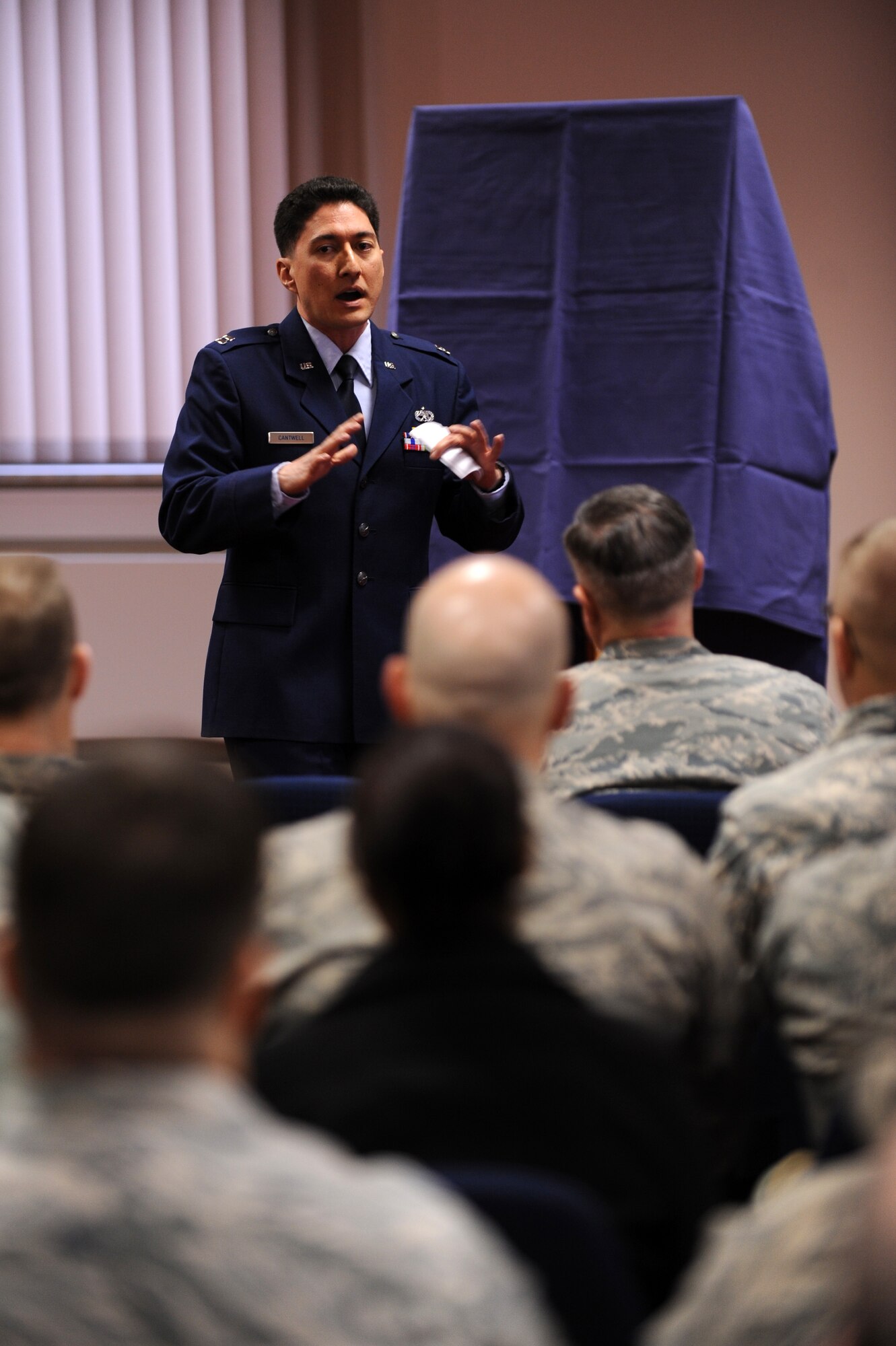 SPANGDAHLEM AIR BASE, Germany – Capt. Hubert Cantwell, 52nd Equipment Maintenance Squadron maintenance operations officer, speaks about the contributions to the Air Force made by Lt. Gen. Leo Marquez at a dedication ceremony at the Eifel Community Center here Jan. 31. Airmen attended the event to honor the Marquez and his 33 years of Air Force service. Some of Marquez’ additions include the implementation of the Air Force Combat Ammunitions Center — an advanced training course for munitions Airmen — and the maintenance badge that all Air Force maintainers now wear. Marquez died Dec. 30, 2011, at age 79. (U.S. Air Force photo/Airman 1st Class Matthew B. Fredericks)