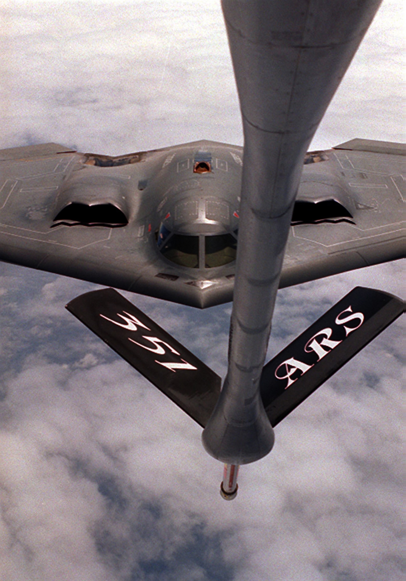 RAF MILDENHALL, England - An 100th Air Refueling Wing KC-135 Stratotanker prepares to offload fuel to a B-2 Spirit stealth bomber. The 100th ARW and subordinate 351st Air Refueling Squadron arrived at RAF Mildenhall Feb. 1, 1992, and has supported U.S. and partner nation military aircraft over a span of more than 20 million square miles using its 15 assigned KC-135 Stratotankers. (U.S. Air Force stock photo)
