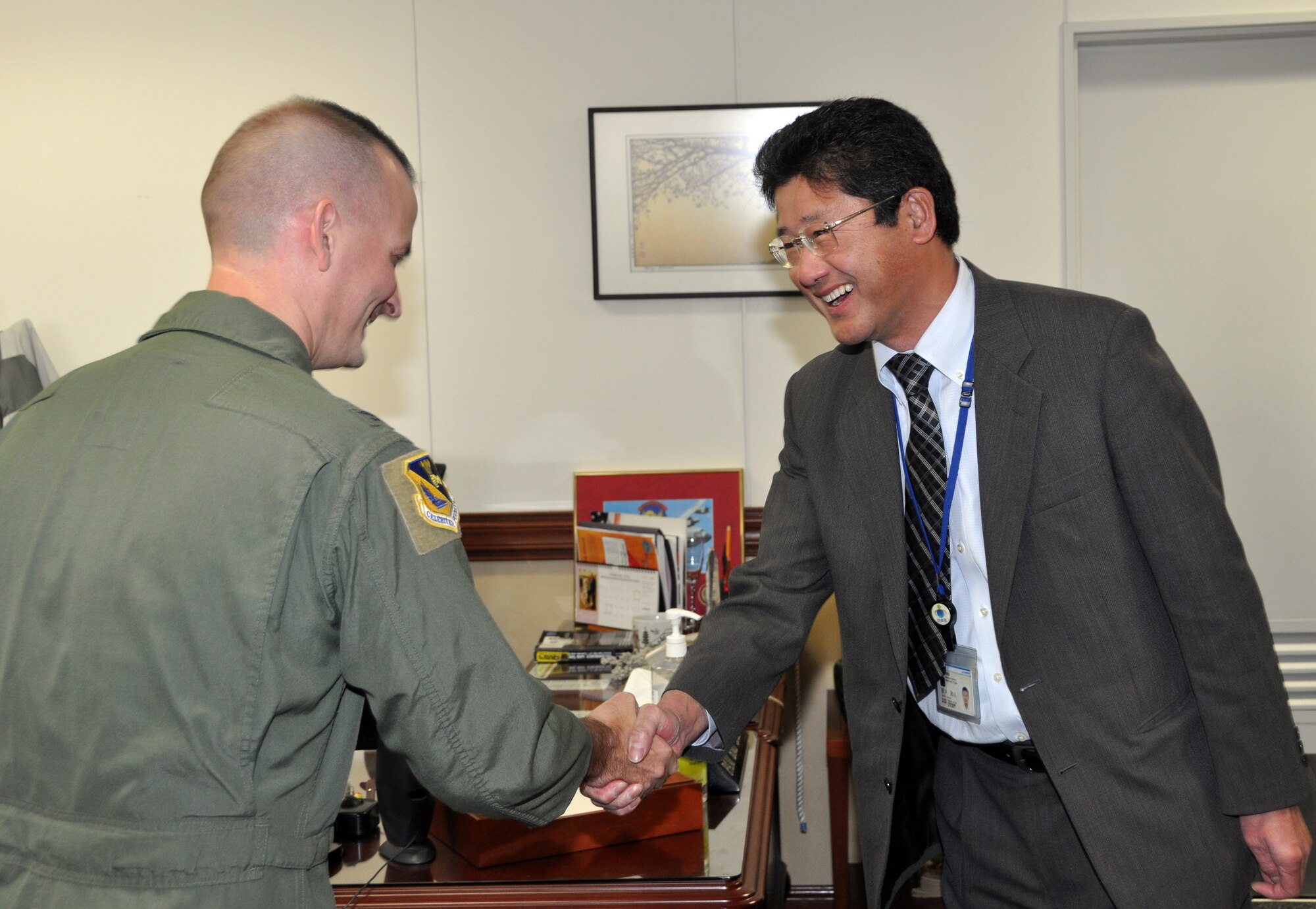 YOKOTA AIR BASE, Japan -- Col. Bill Knight, 374th Airlift Wing vice commander, greets Kazuto Tsutsui, the new Director General for the North Kanto Defense Bureau, Ministry of Defense, before a meeting at Yokota Air Base, Japan, Feb. 1, 2012. The NKDB is a liaison between the U.S. military in Japan, the Japan Self-Defense Forces and local communities. They also finance construction projects to minimize noise problems caused by military bases. Most of the buildings on Yokota Air Base are funded and built by the government of Japan through NKDB. They also monitor construction and maintenance work lead by U.S. forces. (U.S. Air Force Photo/Airman 1st Class Katrina R. Menchaca)