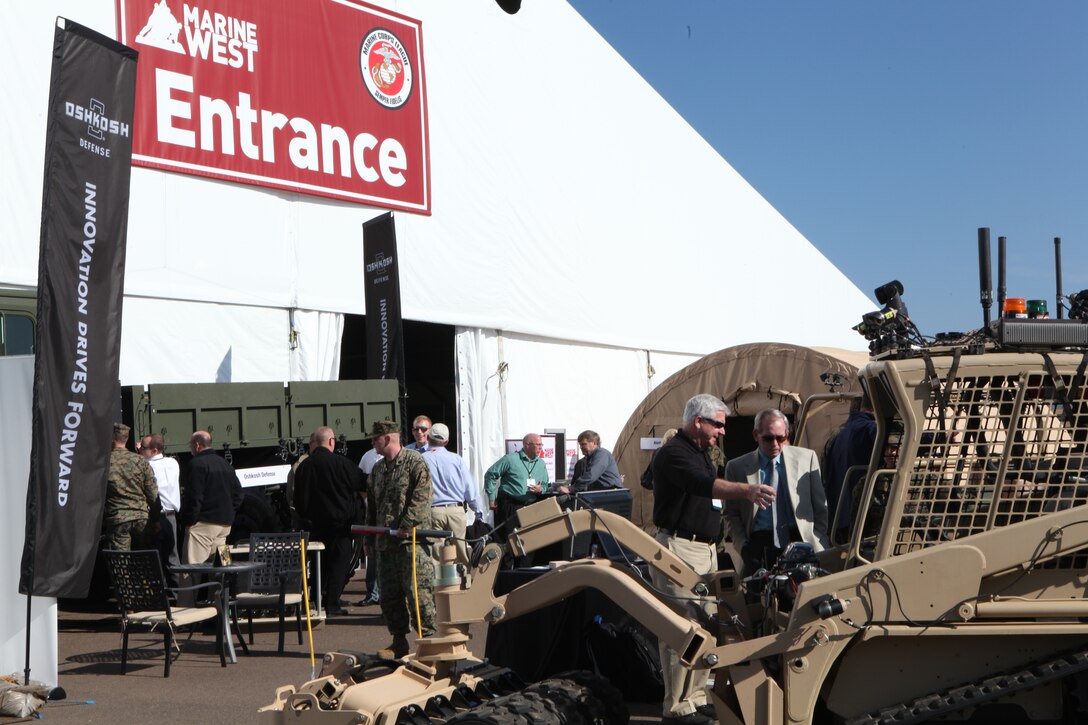 Visitors admire numorous venders and exibits at the Marine West Expo on Camp Pendleton, Feb. 1-2. The Marine Expo is held to educate people on the importance of the new technology available to keep troops safe and more efficient.::r::::n::