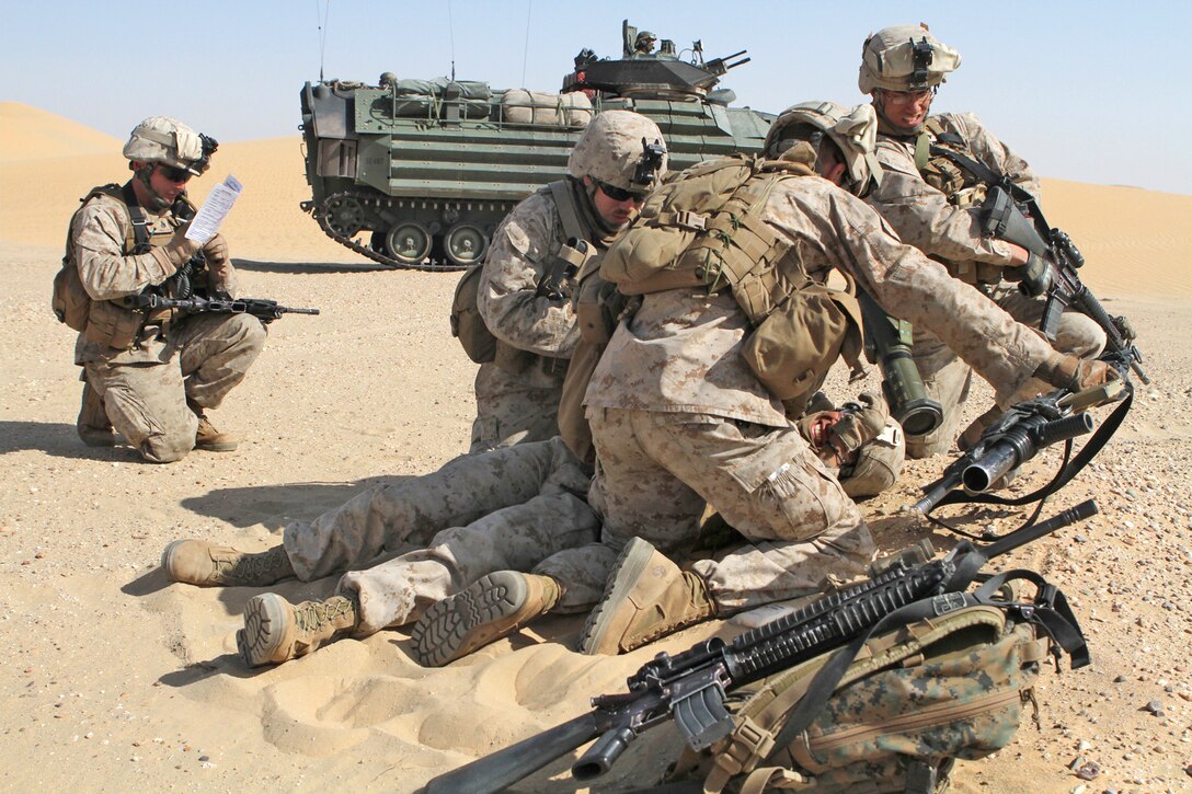 Marines with Company L participate in a battalion-level attack here Jan. 30 during an 11th Marine Expeditionary Unit field exercise. Company L is one of three rifle companies with Battalion Landing Team 3/1, the ground combat element for the unit. The expeditionary unit is currently deployed as part of the Makin Island Amphibious Ready Group, a U.S. Central Command theater reserve force providing support for maritime security operations and theater security cooperation efforts here.