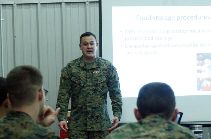 Petty Officer 3rd Class Charles A. Hill, a preventive medicine technician with the Preventive Medicine Unit, 2nd Medical Battalion, 2nd Marine Logistics Group teaches food storage procedures during a Petty Officer Preventive Medicine Course at the PMU compound aboard Camp Lejeune, N.C., Feb. 3, 2012. During the training, sailors learned the procedures for inspecting chow halls. They also learned about food-born illnesses and different types of inspections, such as routine, comprehensive and follow ups. (U.S. Marine Corps photo by Pfc. Franklin E. Mercado)