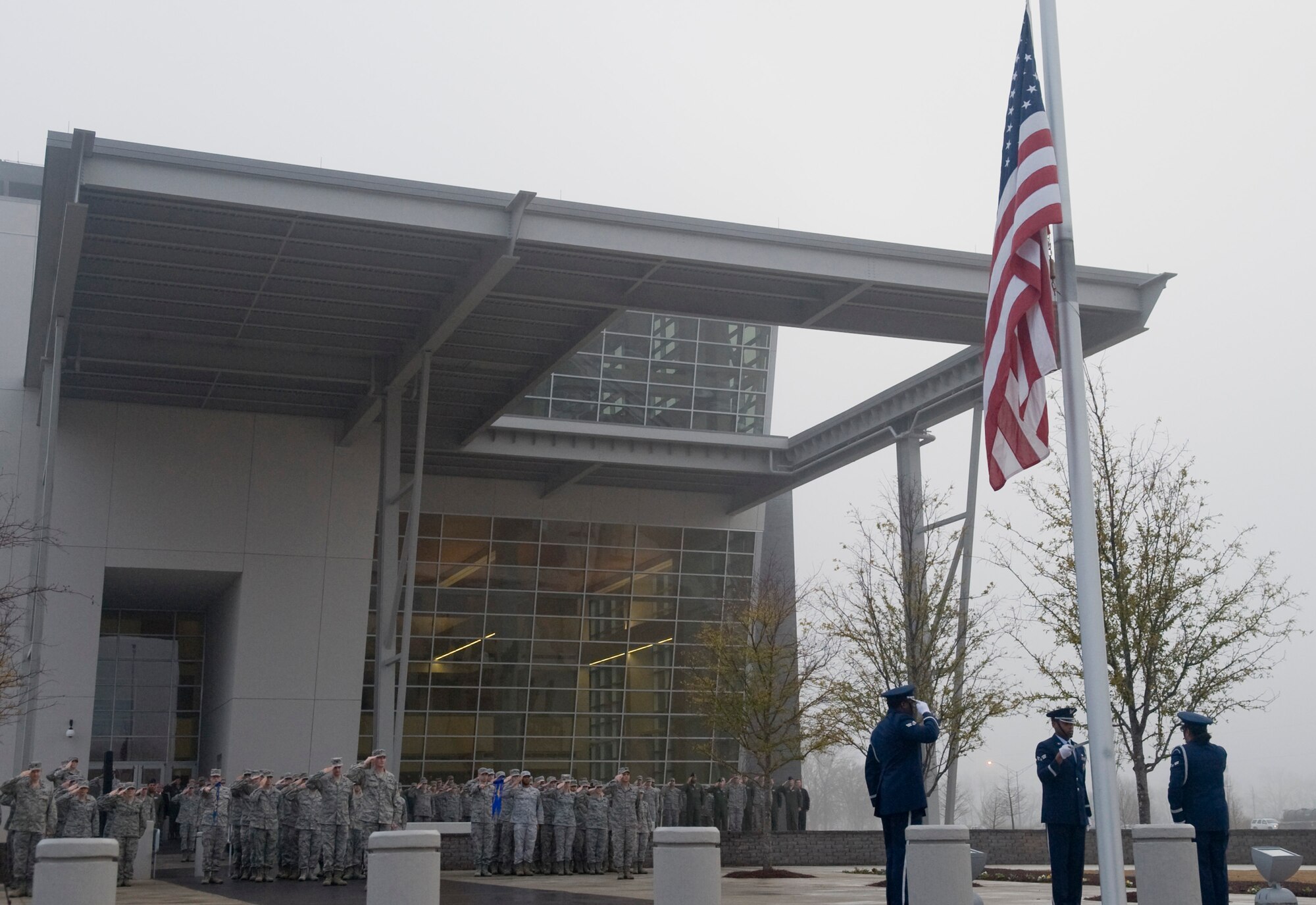Bossier City, La.-- Members of the Mighty 8th Air Force and Barksdale's Honor Guard salute during reveille at the Cyber Innovation Center Celebration of the Mighty Eighth's 70th birthday in Bossier City, La., Feb. 1. The milestone will be celebrated throughout 2012 including special commemorations, dinners, a film screening, as well as Mighty eight-mile run. (U.S. Air Force photo/Senior Airman Kristin High)(RELEASED)