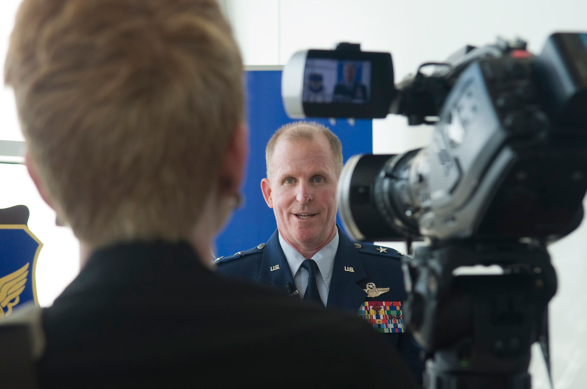 Bossier City, La. -- Maj. Gen. Stephen Wilson, 8th Air Force commander, is interviewed by Erin Buchanan, KTBS Channel 3, during the birthday celebration of the 8th Air Force. The milestone marked the 70th year the Mighty Eighth has been active. (U.S. Air Force photo/Senior Airman Kristin High)(RELEASED)