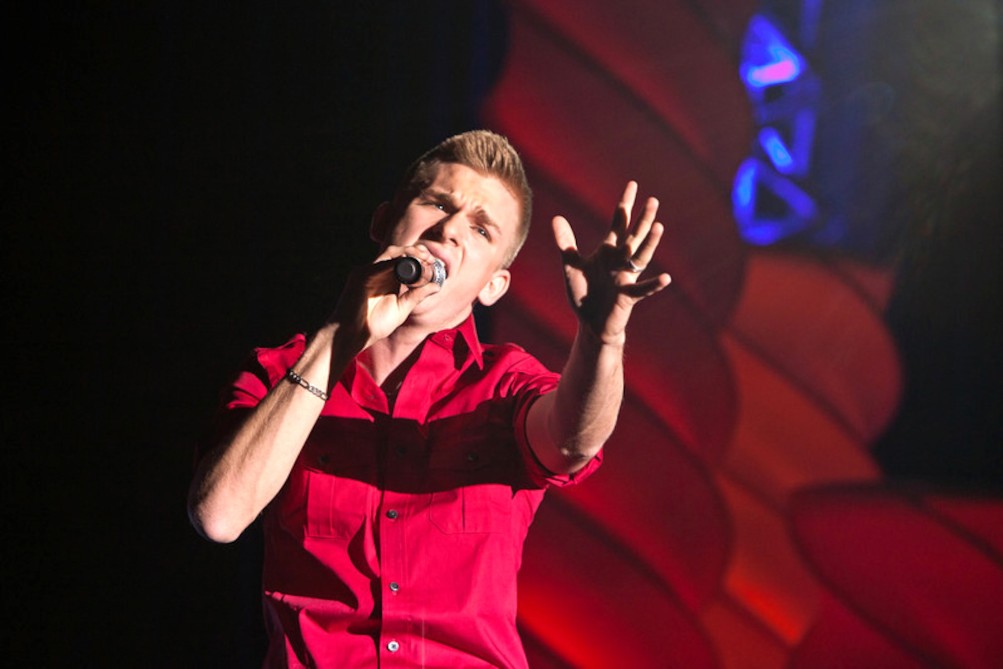 U.S. Air Force Airman 1st Class Joseph Hardeman, 27th Special Operations Civil Engineer Squadron electrical systems specialist, shows-off his vocal abilities at a competition held at Lackland Air Force Base, Texas, Jan. 9-16, 2012.  Hardeman, who is stationed at Cannon Air Force Base, N.M., placed first in the men's vocal division after singing his rendition of ?Set Fire to the Rain? by singer Adele. (U.S. Air Force photo by Maj. Chris Burch)