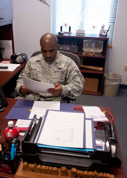 U.S. Air Force Tech. Sgt. Ariesus Preston, 336th Recruiting Squadron support flight chief, looks over paperwork in his office at Moody Air Force Base, Ga., Jan. 27, 2012. Preston oversees personnel and computers for more than 100 recruiters spread across four states. (U.S. Air Force photo by Airman 1st Class Jarrod Grammel/Released)
