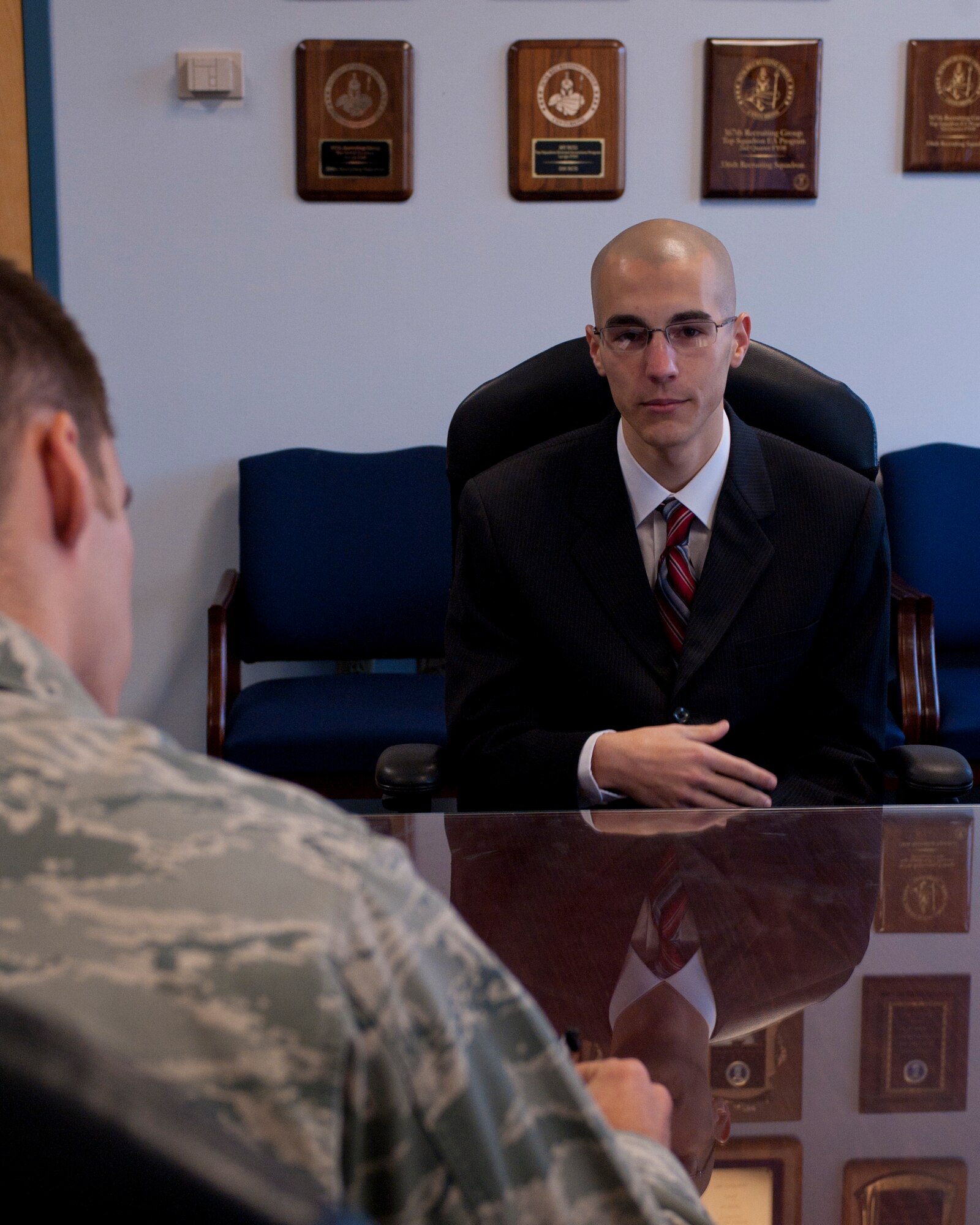 Dustin Bigler, officer applicant, answers questions from the recruiter during an interview at Moody Air Force Base, Ga., Feb. 3. Recruiters frequently  conduct these interviews which is a key part of the application process to become an officer. (U.S. Air Force photo by Airman 1st Class Jarrod Grammel/Released)
