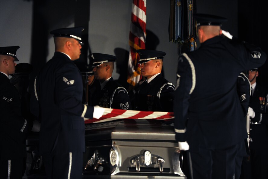 The U.S. Air Force Honor Guard conducts a mock funeral at the base theater during the 11th Wing Resiliency Day commanders call Jan. 26. The presentation was meant to highlight the effects on friends and family left behind after someone commits suicide. (U.S. Air Force photo/Airman Aaron Stout)

