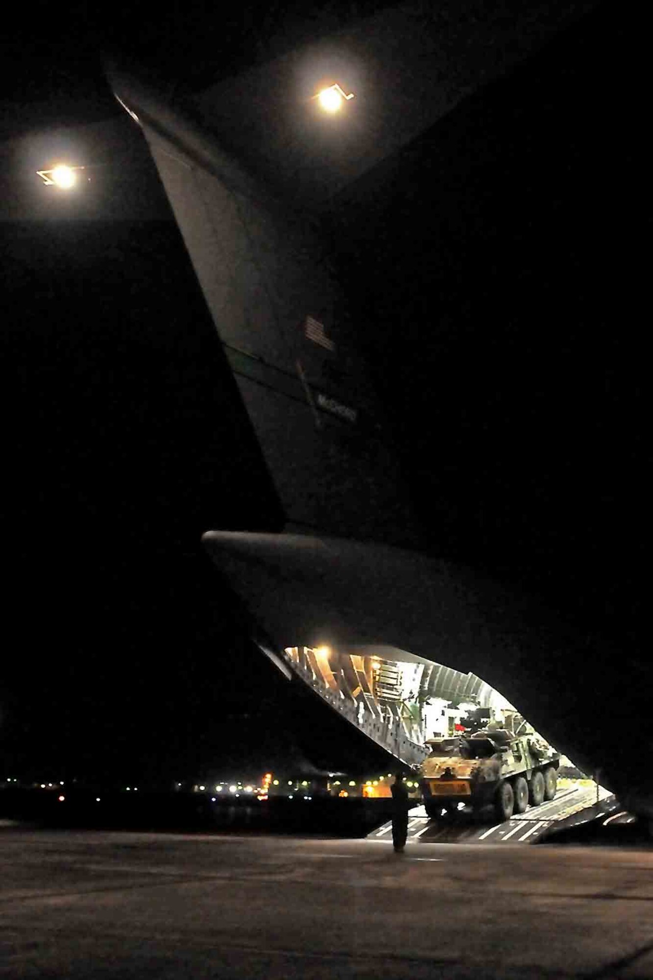 Soldiers from 4th Stryker Brigade Combat Team, 2nd Infantry Division drive a command vehicle down the ramp of an Air Force C-17 Globemaster III aircraft from the 62nd Airlift Wing Jan. 28, 2012, in Moses Lake, Wash. Soldiers of 4th SBCT, 2nd Inf. Div. are participating in Exercise Raider Focus, a month-long brigade training exercise, and this marks the first time Strykers have been airlifted from JBLM to Yakima. (U.S. Army photo by Spc. Reese Von Rogatsz, 4th SBCT PAO, 2nd Inf. Div.)