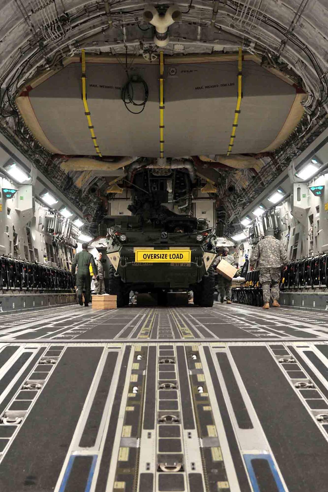Soldiers of 4th Stryker Brigade Combat Team, 2nd Infantry Division prepare a Stryker vehicle for transport in a C-17 Globemaster III aircraft from the 62nd Airlift Wing Jan. 28, 2012, at Joint Base Lewis-McChord, Wash. Soldiers of 4th SBCT, 2nd Inf. Div. are participating in Exercise Raider Focus, a monthlong brigade training exercise, and this marks the first time Strykers have been airlifted from JBLM to Yakima. (U.S. Army photo by Spc. Reese Von Rogatsz, 4th SBCT PAO, 2nd Inf. Div.)