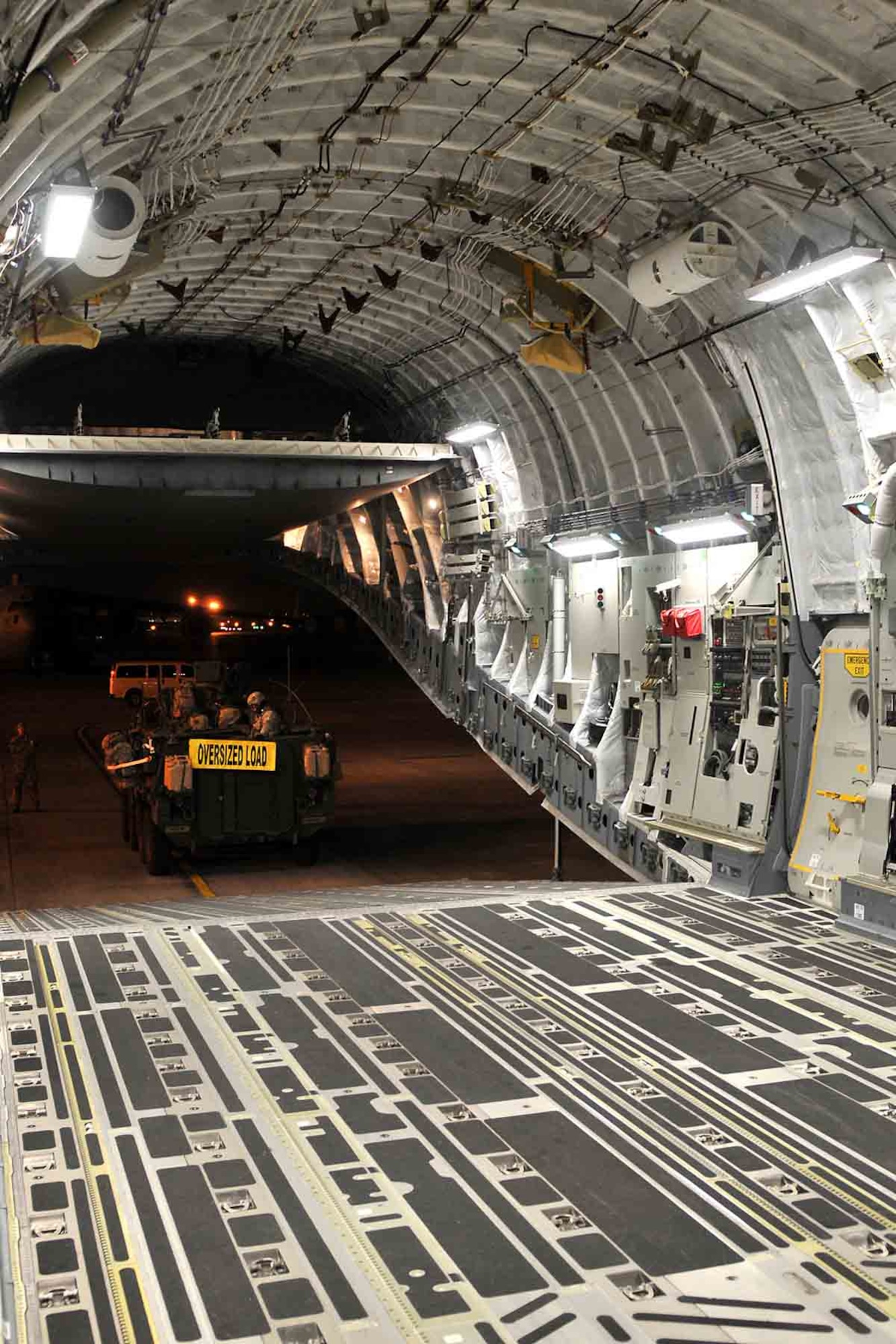 Soldiers from 4th Stryker Brigade Combat Team, 2nd Infantry Division drive a Stryker command vehicle into the cargo hold of an Air Force C-17 Globemaster III aircraft from the 62nd Airlift Wing Jan. 28, 2012, at Joint Base Lewis-McChord, Wash., for transport to Exercise Raider Focus here. This marks the first time Strykers have been airlifted from JBLM to Yakima. (U.S. Army photo by Spc. Reese Von Rogatsz, 4th SBCT PAO, 2nd Inf. Div.) 