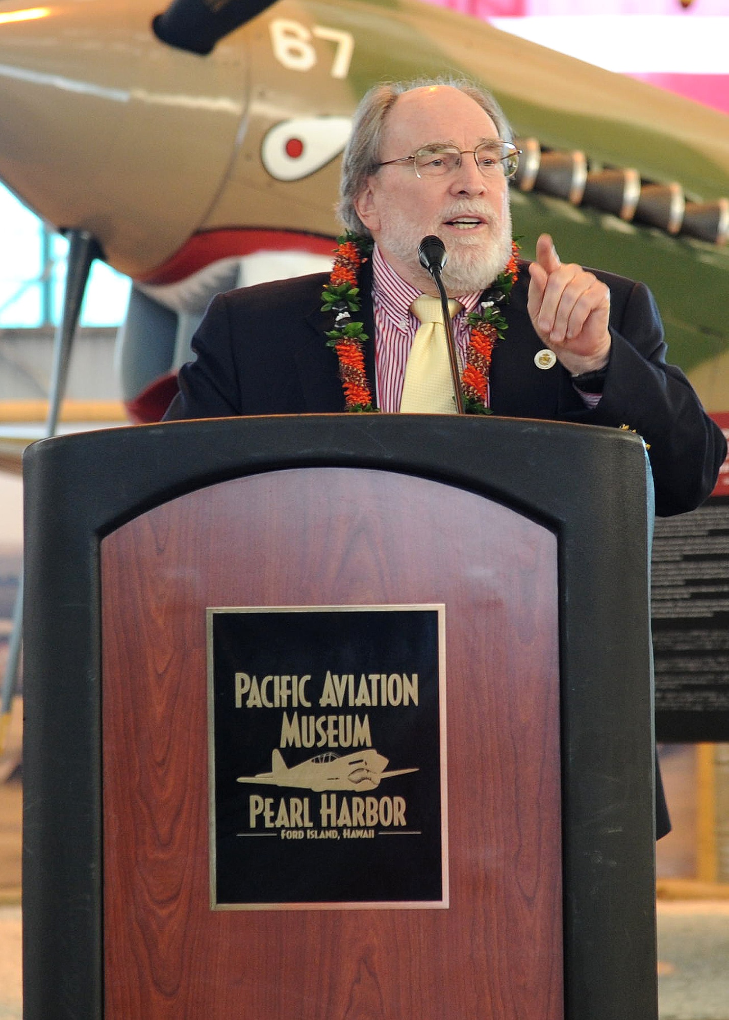 FORD ISLAND, Hawaii--Gov. Neil Abercrombie speaks to an audience during an event celebrating the legacy of the U.S.-China friendship, held at the Pacific Aviation Museum, Ford Island, Hawaii, Jan. 30, 2012. During the event, the President of the Chinese People’s Association for Friendship with Foreign Countries, Madame Li Xiaolin, presented her film documentary, Touching the Tigers, which tells the story of the late ‘Flying Tigers’ pilot Lt. Glen Beneda. Beneda was a fighter pilot with 14th Air Force, who was shot down and wounded while defending China from Japanese forces during World War II. The documentary also details how Chinese farmers and soldiers helped Beneda escape capture before he was returned to a U.S. air base for medical care. (U.S. Air Force photo/Tech. Sgt. Jerome S. Tayborn/Released)