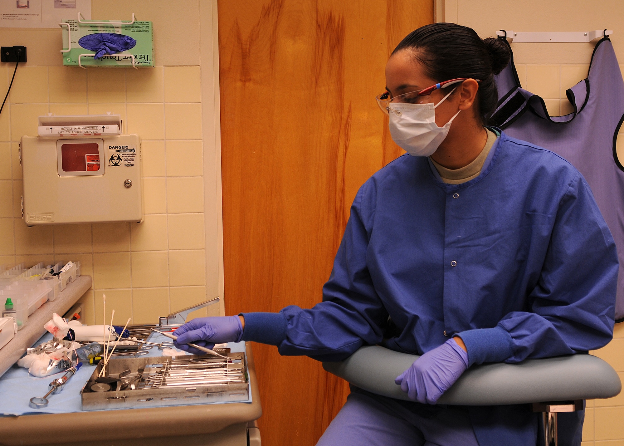 Airman 1st Class Ashley Wall, 9th Aerospace Medicine Squadron dental technician, prepares a dental tray at the dental clinic at Beale Air Force Base, Calif., Jan. 31, 2012. Wall is about to assist the doctor with a routine semantic crown for an inbound patient.  (U.S. Air Force photo by Airman 1st Class Brittany Paerschke-O'Brien/ Released)