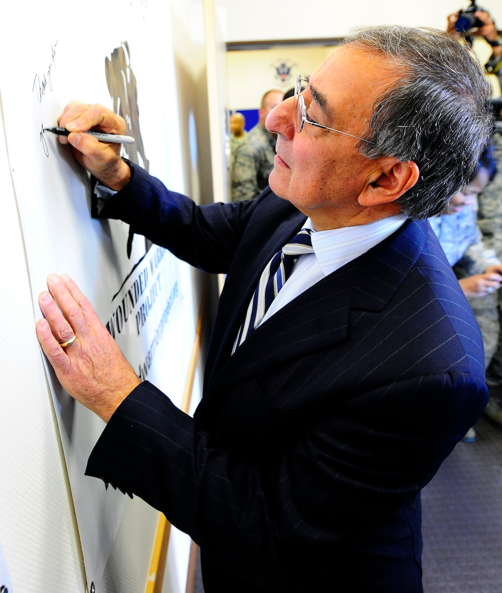 Secretary of Defense Leon Panetta signs a Wounded Warrior banner in the Contingency Aeromedical Staging Facility at Ramstein Air Base, Germany, Feb. 3, 2012. During his visit, the 23rd defense secretary expressed appreciation for the dedication and hard work of the service members who ensure wounded warriors receive world-class care.