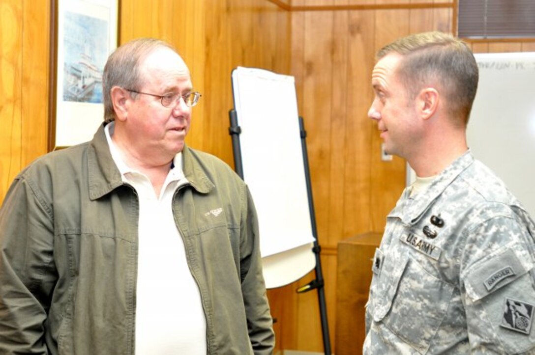 NASHVILLE, Tenn. — Jim Davis (left), U.S. Army Corps of Engineers Nashville District Tennessee River Operations manager, who was in the first lock operator graduation class in 1968, talks with Lt. Col. James DeLapp, Nashville District commander, at the last lock operator graduation at J. Percy Priest Lake, Jan. 31, 2012.