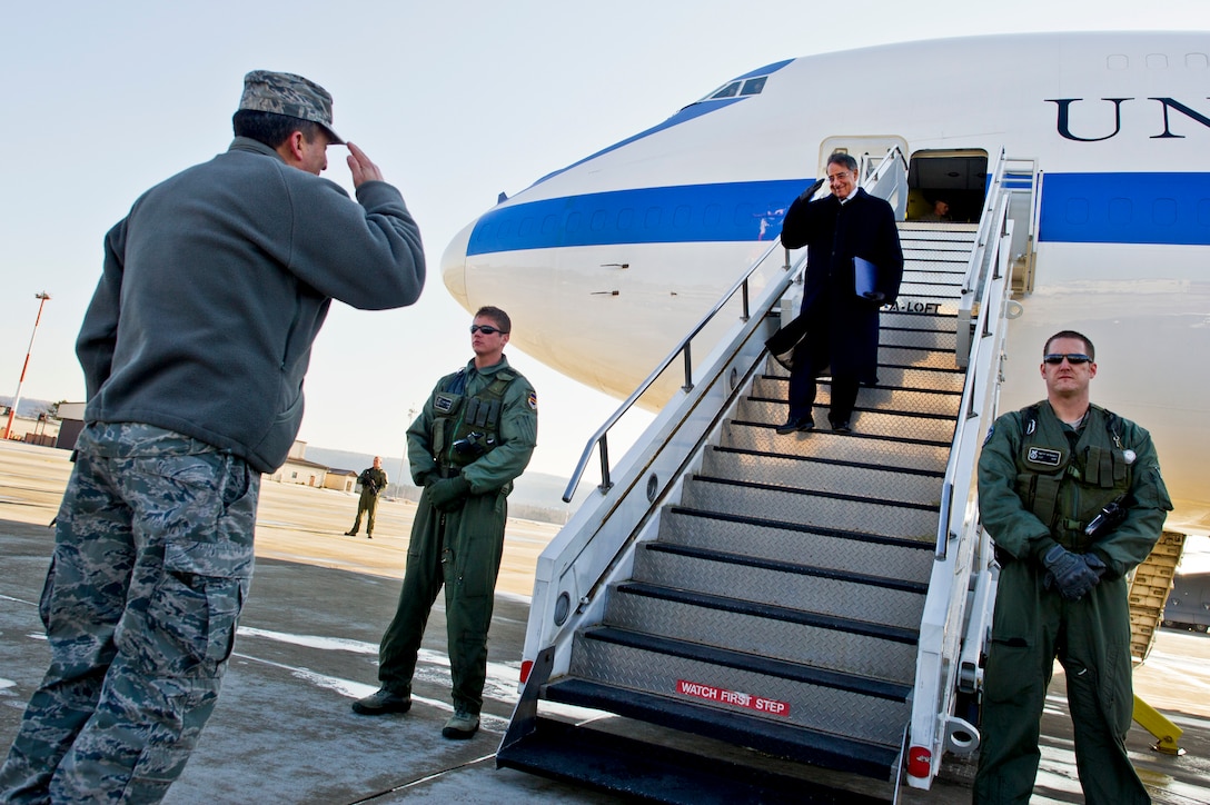 U.S. Defense Secretary Leon E. Panetta returns the salute of U.S. Air Force Lt. Gen. Stephen P. Mueller, vice commander of U.S. Air Forces in Europe, after arriving on Ramstein Air Base, Germany, Feb. 3, 2012. Panetta traveled to Ramstein and Landstuhl Regional Medical Center to visit patients, and thank service members directly involved with the transportation and care of wounded warriors.