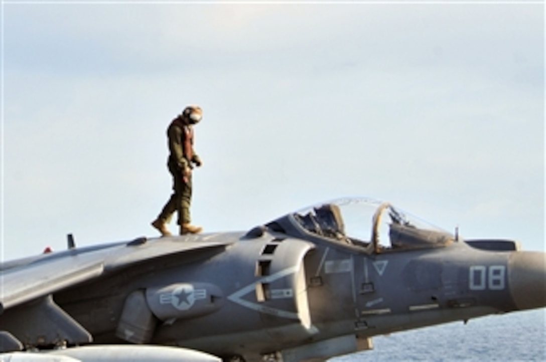 A Marine assigned to Marine Fighter Squadron 231 inspects an AV-8B Harrier before flight operations aboard the amphibious assault ship USS Kearsarge (LHD 3) during Bold Alligator 2012 in the Atlantic Ocean on Feb. 2, 2012.  The exercise will take place Jan. 30 through Feb. 12, 2012, afloat and ashore in and around Virginia and North Carolina.  