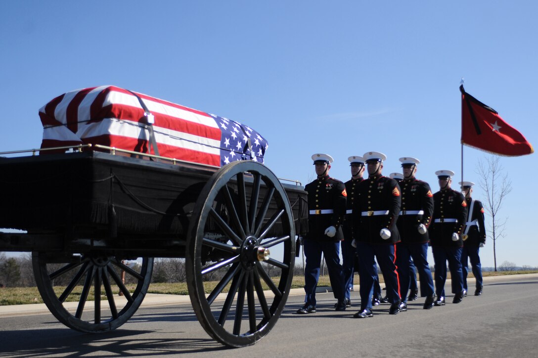 Marine Corps Body Bearers from Marine Barracks Washington march behind the caisson during the funeral service for Brig. Gen. William Lanagan (1923-2011) in Arlington National Cemetery Feb 3. As a first lieutenant, Lanagan founded and served as the first platoon commander of the Marine Corps Silent Drill Platoon in 1948. Lanagan served in World War II, Korea and Vietnam, where he earned the Legion of Merit Medal with a Combat V.