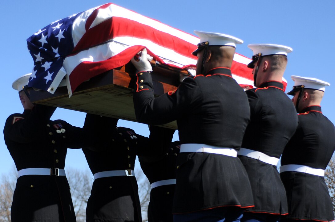 Marine Corps Body Bearers from Marine Barracks Washington raise the casket of Brig. Gen. William Lanagan (1923-2011) to eye level, serving as a final salute to the fallen Marine, before laying him to rest at Arlington National Cemetery Feb 3. As a first lieutenant, Lanagan founded and served as the first platoon commander of the Marine Corps Silent Drill Platoon in 1948. Lanagan served in World War II, Korea and Vietnam, where he earned the Legion of Merit Medal with a Combat V.