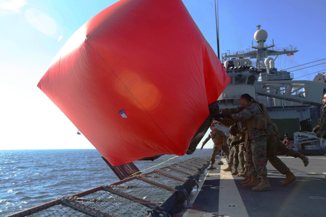 Marines and Sailors with Combat Logistics Battalion 24, 24th Marine Expeditionary Unit, and Charlie Company, Battalion Landing Team 1st Battalion, 2nd Marine Regiment, 24th MEU, push a Killer Tomato, a target used for shooting at sea, off the side of the ship, Feb. 3. The Marines and Sailors spent the day firing M-240B medium machine guns and M-249 squad automatic weapons off the back of Internally Transportable Vehicles. The training took place during the 24th MEU’s Certification Exercise (CERTEX) with Amphibious Squadron 8 (PHIBRON 8) scheduled Jan. 27 to Feb. 17, which includes a series of missions intended to evaluate and certify the unit for their upcoming deployment.