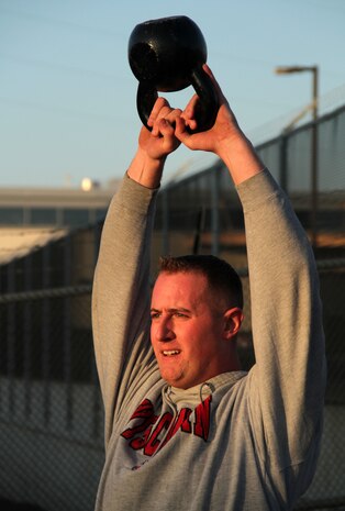 Eau Claire, Wis., recruiter Sgt. Cody D. Stauner performs kettlebell swings during a Helen workout at CrossFit Minneapolis Feb. 4. More than a dozen recruiters attended the three-day training seminar to enhance fitness levels and decrease Delayed Entry Program washout rate. For additional imagery from the event, visit www.facebook.com/rstwincities.