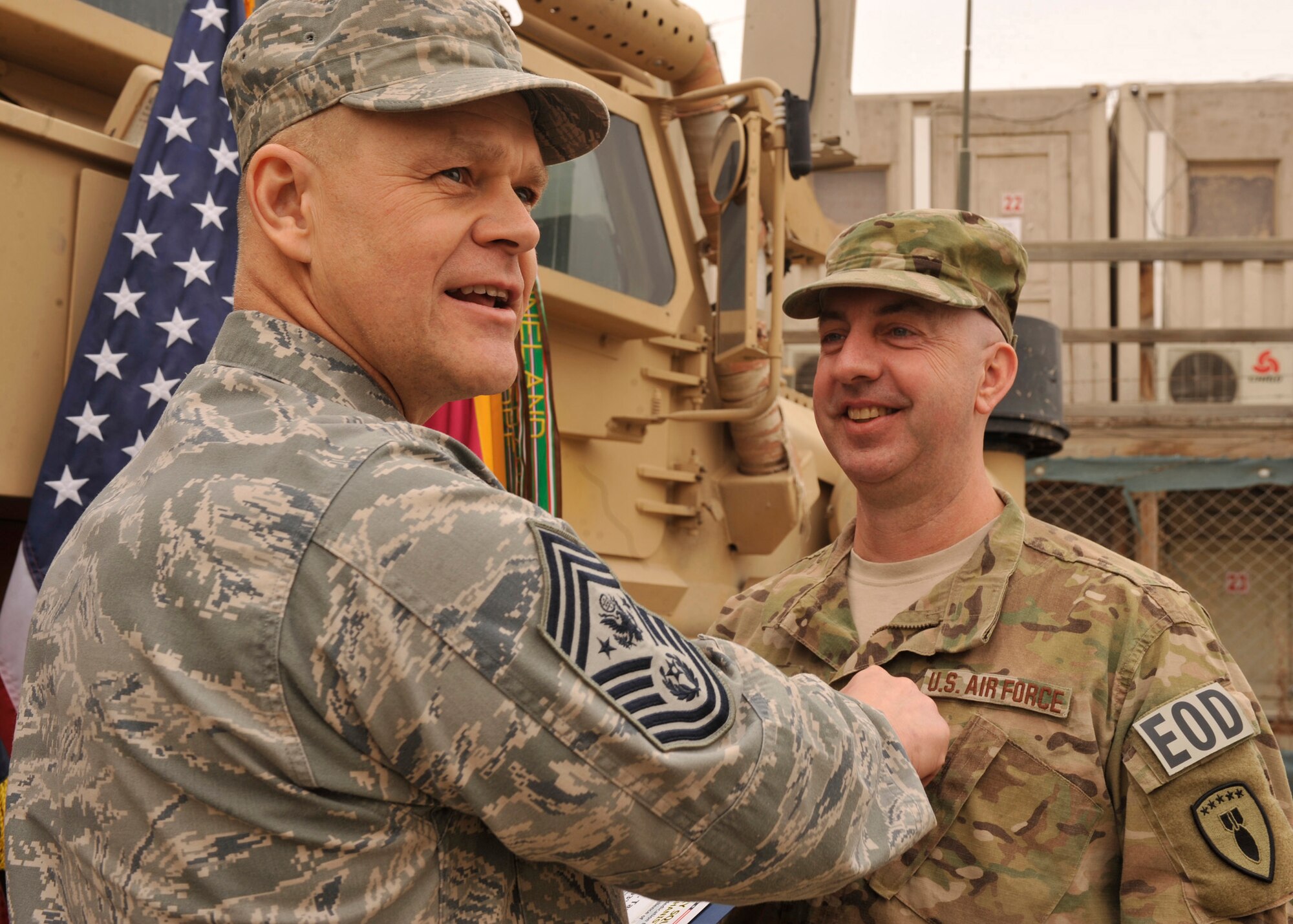 BAGRAM AIRFIELD, Afghanistan— Chief Master Sgt. of the Air Force James Roy pins Senior Master Sgt. Timothy Tart’s new rank on his uniform at Bagram Airfield, Afghanistan, Feb. 2, 2012. Tart is a senior noncommissioned officer with the 966th Air Expeditionary Squadron and was honored to have the chief master sergeant of the Air Force present at his promotion ceremony. (U.S. Air Force photo/Airman 1st Class Ericka Engblom)