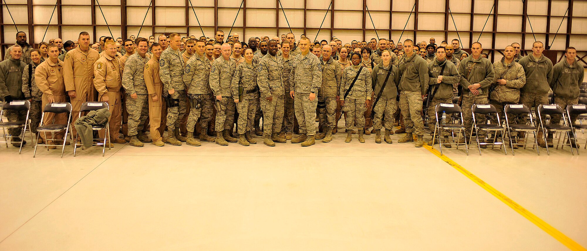 BAGRAM AIRFIELD, Afghanistan— Airmen stand with Chief Master Sgt. of the Air Force James Roy at Bagram Airfield, Afghanistan, Feb. 2, 2012. The Airmen were gathered together for an Airmen’s Call, one of several meetings that the chief master sergeant of the Air Force had with groups of enlisted members . Airmen were given the opportunity to ask questions and give opinions on important matters. (U.S. Air Force photo/Airman 1st Class Ericka Engblom)