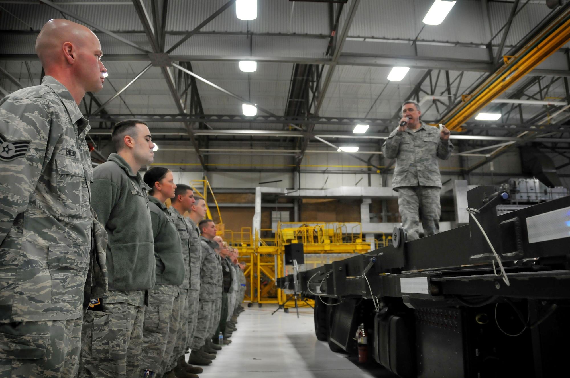 Col. Darrell G. Young, 934th Airlift Wing commander, briefs unit members about the recent force structure change announcement and how it may affect the 934th AW during a morning wing commander's call. (U.S. Air Force photo by Tech Sgt. Bob Sommer)