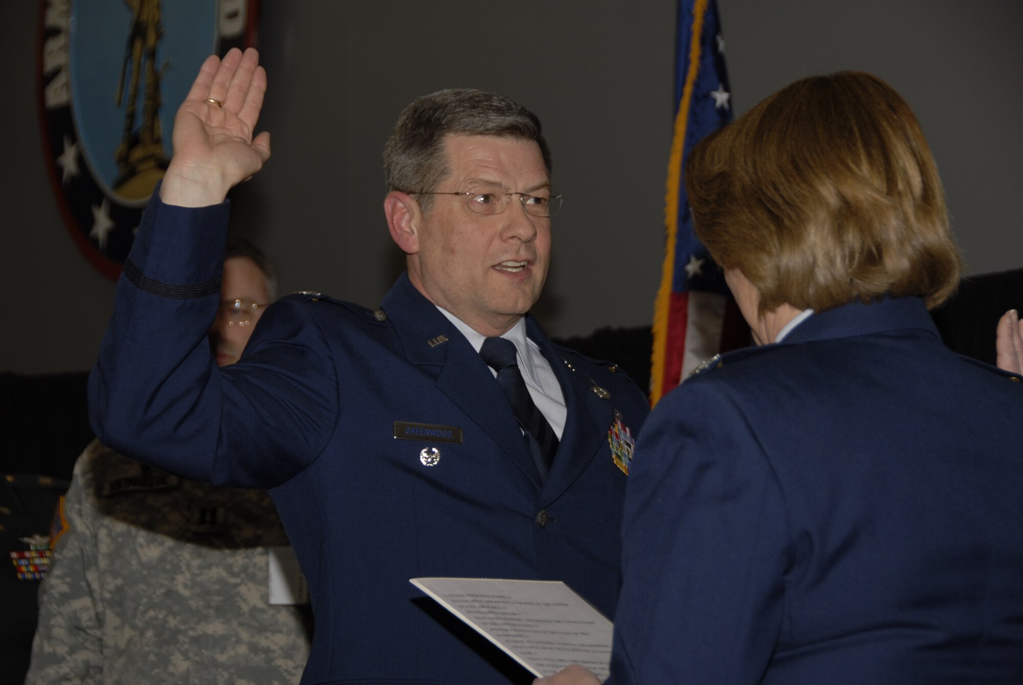 CONCORD, N.H. -- Brig. General Deborah Carter (then Colonel), administers the oath of office to Col. Rick Greenwood during his promotion ceremony at the Joint Forces Headquarters drill hall in Concord, March 25, 2009.  (National Guard photo by Tech. Sgt. Aaron Vezeau/Released)
