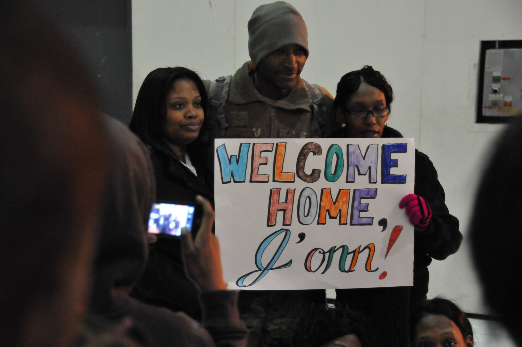 Senior Airman J'onn Alexander, 126th Security Forces Squadron security team
member, poses for a photo with family members after arriving back home from
a six month deployment to Afghanistan in support of Operation Enduring
Freedom. The Illinois Air National Guard unit, located at Scott AFB, Ill.,
has deployed many personnel in support of both Operation Iraqi Freedom and
Operation Enduring Freedom since September 11, 2001. (US Air Force photo by
Master Sgt. Ken Stephens)
