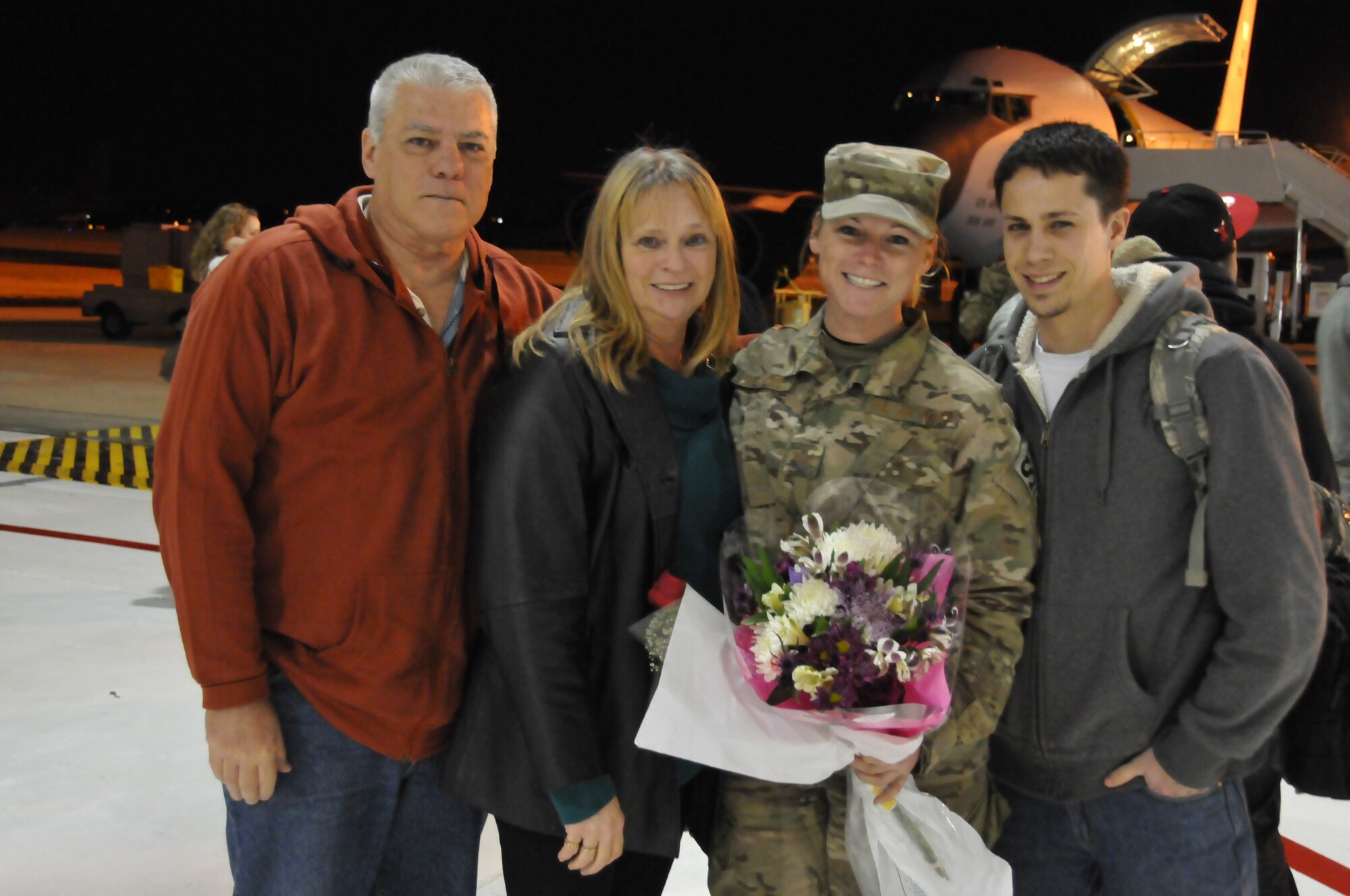 Staff Sgt. Michelle Wilson, 126th Security Forces Squadron security team
member, poses with her family and fiancé after returning from a six month
deployment to Afghanistan in support of Operation Enduring Freedom. The
Illinois Air National Guard unit, located at Scott AFB, Ill., has deployed
many personnel in support of both Operation Iraqi Freedom and Operation
Enduring Freedom since September 11, 2001. (US Air Force photo by Master
Sgt. Ken Stephens)
