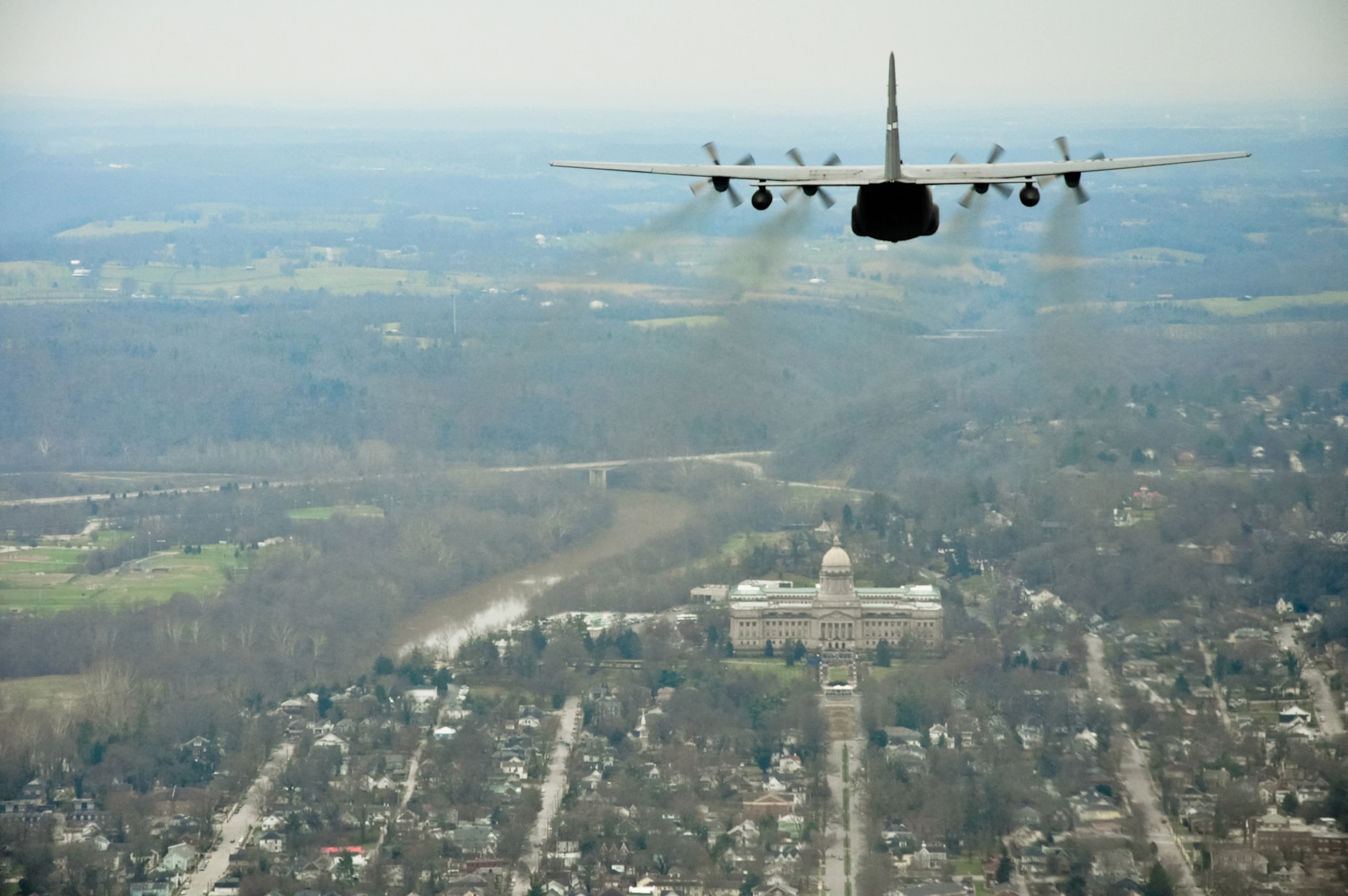 A Kentucky Air National Guard C-130 Hercules flies over the state Capitol Building Dec. 13 as part of the inauguration ceremony for Gov. Steve Beshear, who was being sworn in for his second four-year term as the Commonwealth's top elected official. He later re-appointed Maj. Gen. Edward Tonini for his second term as the state's adjutant general. (U.S. Army photo by Sgt. 1st Class Michael Oliver)