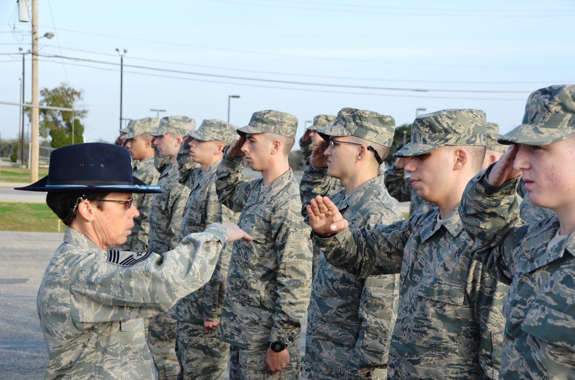 Chief Master Sgt. Julie Begley, Squadron Suprintendent,  433rd Training Squadron instructs Airmen at Basic Training how to render a proper salute.  The MTI reservists’ role in the Basic Military Training arena is to assist the active duty in manning shortfalls and be part of the Total Force Initiative within Air Education and Training Command and the Air Force Reserve Command," said Chief Master Sgt. Begley.(U.S. Air Force Photo/ Senior Master Sgt. Minnie Jones)