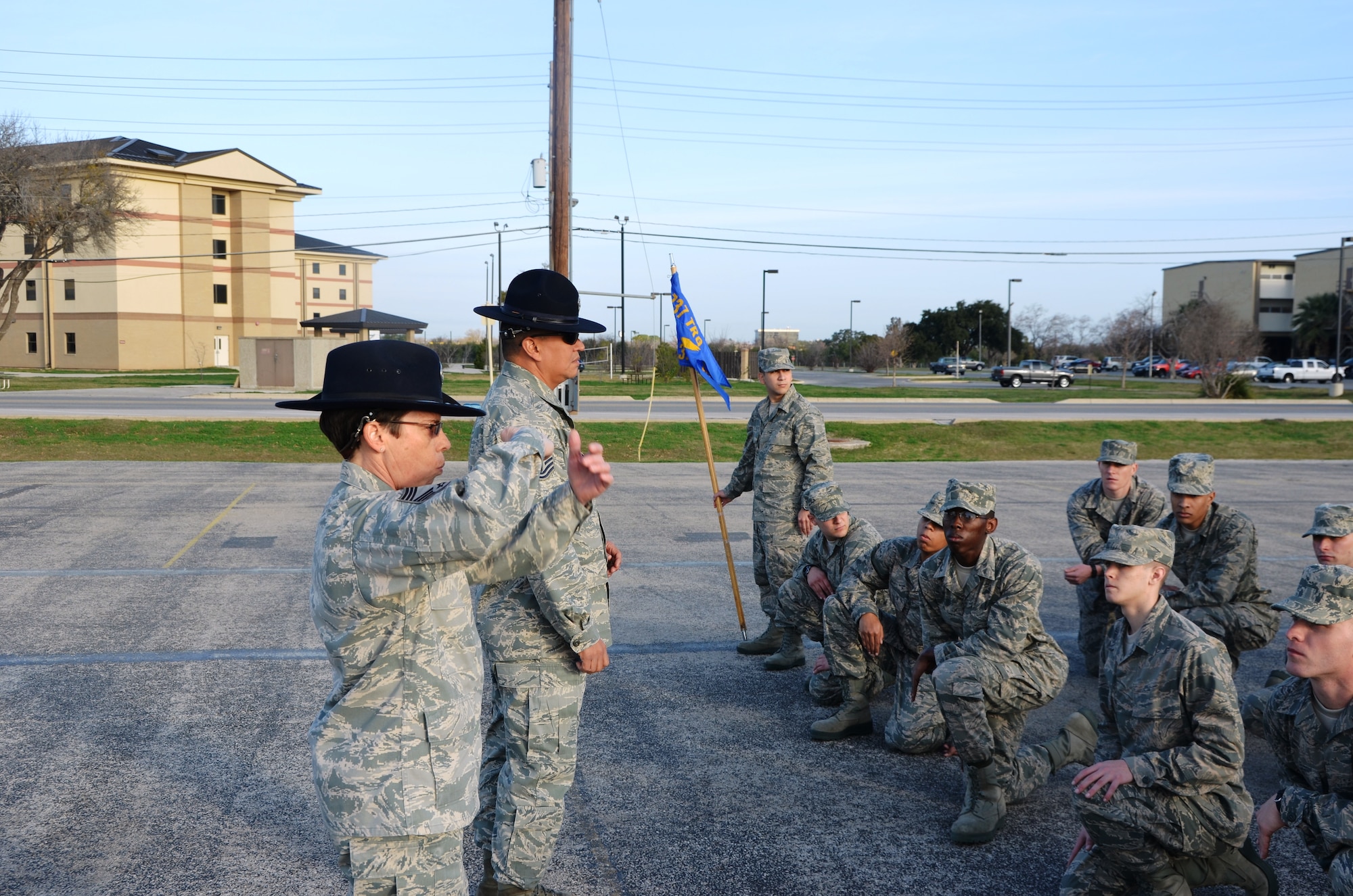 (Right) Chief Master Sgt. Julie Begley and Tech. Sgt. Carlos Recoder brief a flight of basic military trainees during Basic Training. "I found that being a MTI has afforded me the opportunity of training America's Airmen," said Recorder, an El Paso native who transferred to the Air Force Reserve from the active-duty U.S. Marine Corp. (U.S. Air Force Photo/ Senior Master Sgt. Minnie Jones)