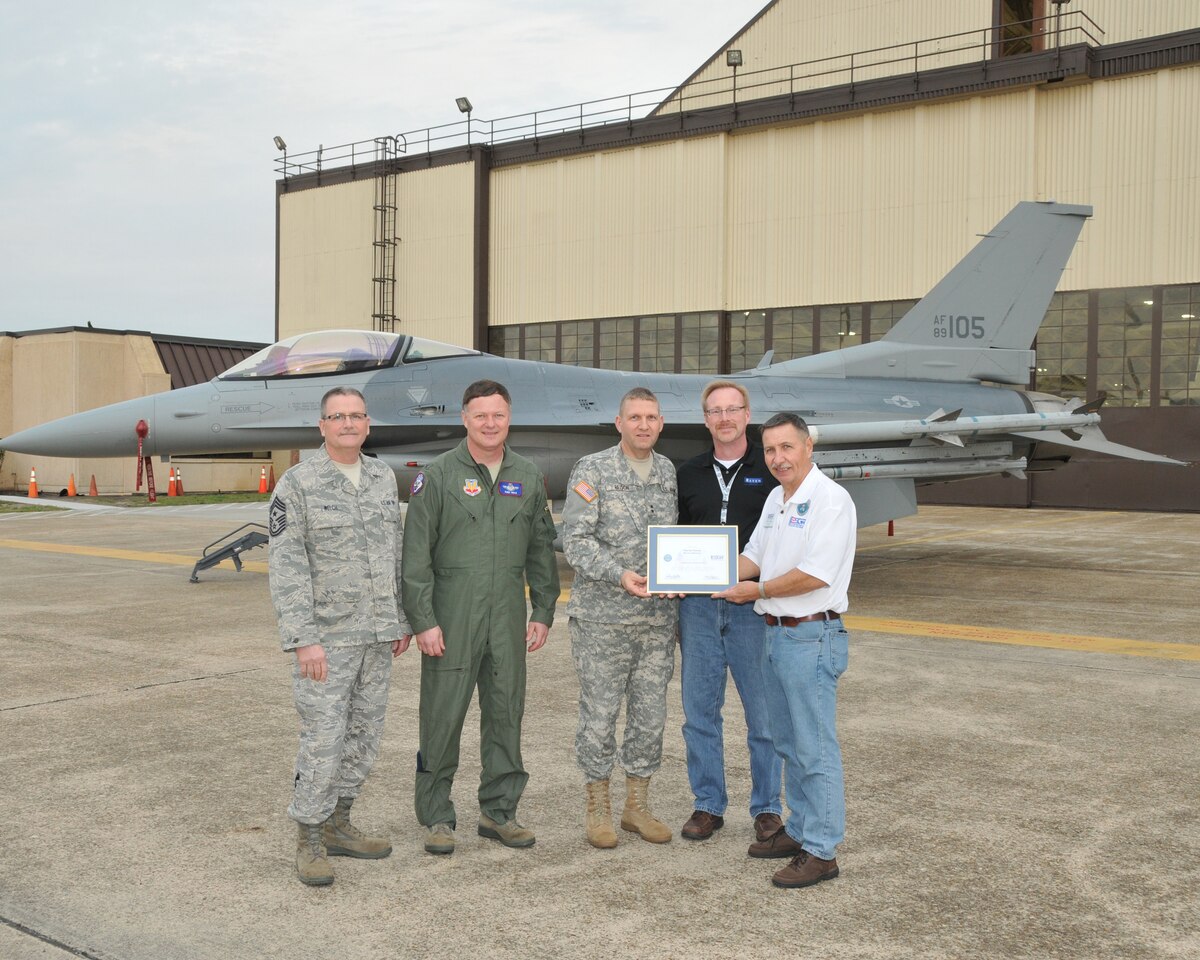 TYNDALL AFB, Fla. - Maj. Gen. Tim Reisch presents the Patriot Award to Martin Harms from Raven Industries during an Employer Support of the Guard and Reserve Bosslift Jan. 31.  Also pictured (from left to right) Command Chief Master Sgt. James Welch, Col. Russ Walz, and on the far right ESGR volunteer Don Kelpin. The Patriot Award is presented by the ESGR to employers who show outstanding support of their National Guard employees and the employees themselved nominate their boss for the award.(National Guard photo by Master Sgt. Christopher Stewart)(RELEASED)