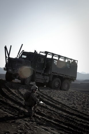 Sergeant Jessica Lugo, Female Engagement Team 6 leader in support of 3rd Battalion, 7th Marine Regiment, waits to step off on a two-day operation here, recently. Lugo, a native of San Pedro, Calif., led a team responsible for interacting with the local populace. Afghan National Army soldiers from 4th Tolai, 2nd Kandak, 2nd Brigade, 215th Corps, and Marines from 3rd Bn. 7th Mar., searched the area for insurgent activity.