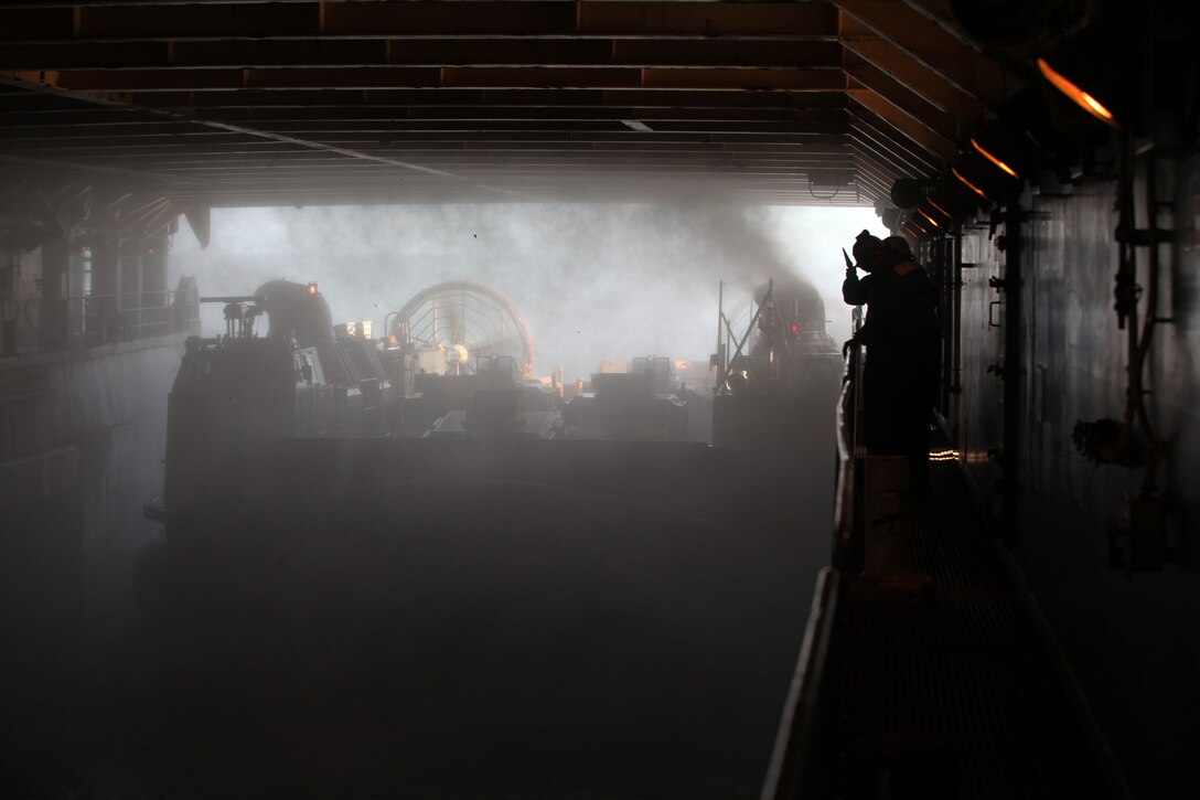 A Landing Craft Air Cushioned hovercraft enters the ship’s well deck, Feb. 4 as a means to practice loading and offloading from shore to ship, and ship to shore. Transportation of assets and personnel from shore and between ships are common operations for Marines and Sailors with the 24th Marine Expeditionary Unit and the Iwo Jima Amphibious Ready Group. The 24th MEU is conducting their Certification Exercise (CERTEX) with Iwo Jima ARG scheduled Jan. 27 to Feb. 17, which includes a series of missions intended to evaluate and certify the unit for their upcoming deployment.