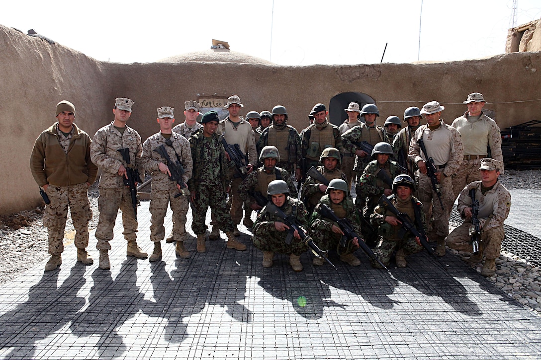 The Marines of 2nd Battalion, 4th Marines employ a four-man team to accompany the Afghan National Security Forces in Now Zad, Afghanistan. The teams are partnered with the Afghan forces in every aspect, they eat, live, patrol and guide them constantly. They teach every aspect of military operations; placement of posts, guard operations, counter IED techniques, planning and conducting security patrols as well as other military tactics and techniques.