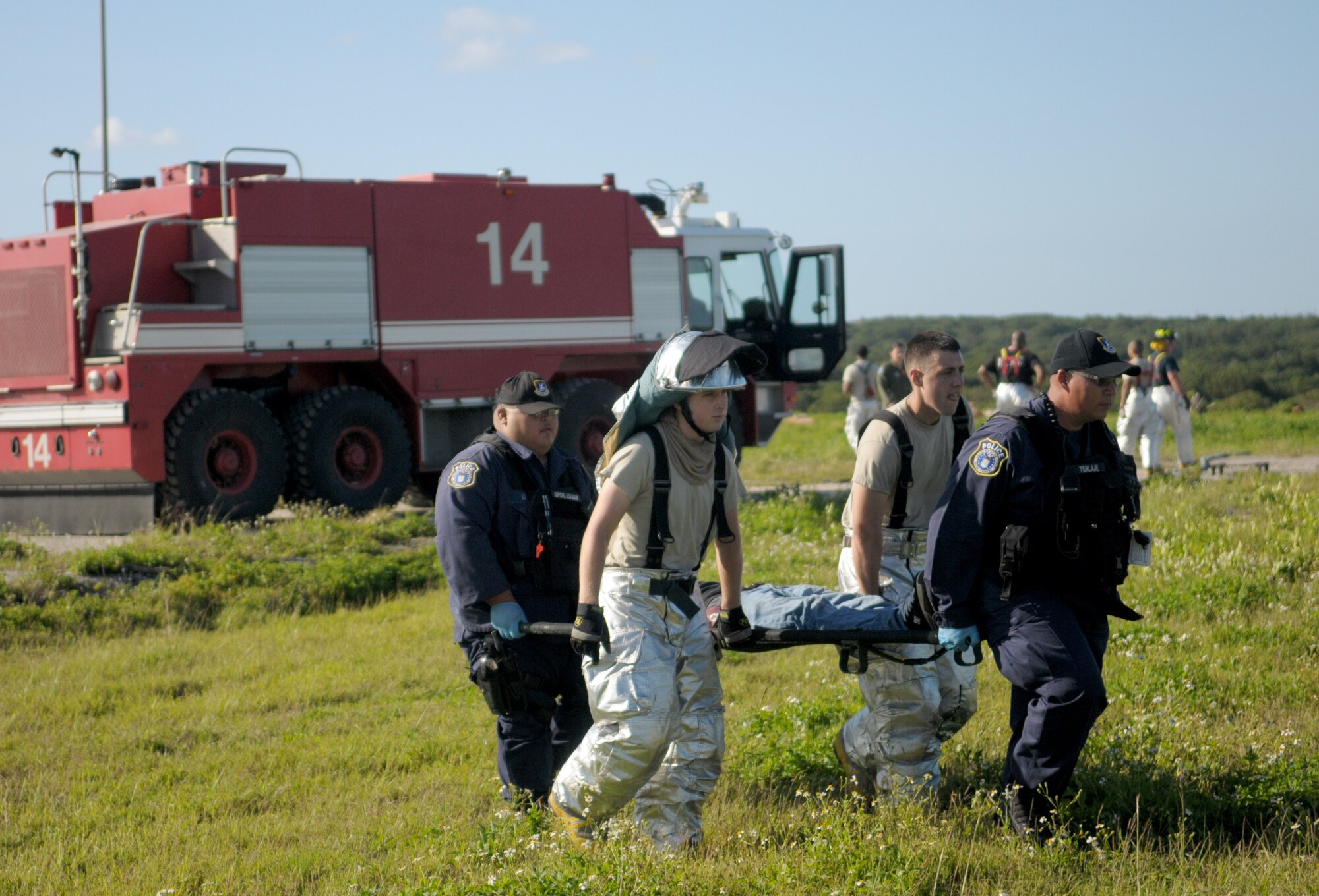 Participating Airmen and emergency response personnel respond to a simulated C-17 crash near the runway during a joint exercise Jan. 30. The exercise was unique because not only did Airmen carry out emergency response procedures, they also completed the initial steps for recovery and, for the first time, provided the necessary products to initiate a safety investigation board. (U.S. Air Force photo/Senior Airman Jeffrey Schultze) 

