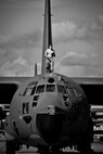 An Airman walks across the top of a MC-130E Combat Talon I at Duke Field, Fla.  Currently, the 919th Special Operations Wing has nine Talons on its flightline.  The maintenance of those aircraft is the responsibility of the 919th Maintenance Group.  (U.S. Air Force photo/Tech. Sgt. Samuel King Jr.)