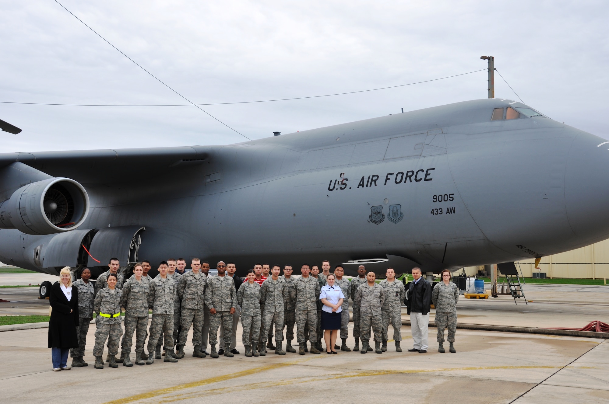 2/5/2012 - New Airmen to the 433rd Airlift Wing gather in front of a C-5A Galaxy cargo aircraft during a tour introducing them to Lackland Air Force Base, Texas, Feb 5. The tour served as a way to help get incoming Alamo Wing members acclimated to the sites of Lackland and assisted with questions about the wing. (U.S. Air Force photo/ Technical Sgt. Carlos J. Trevino)  

