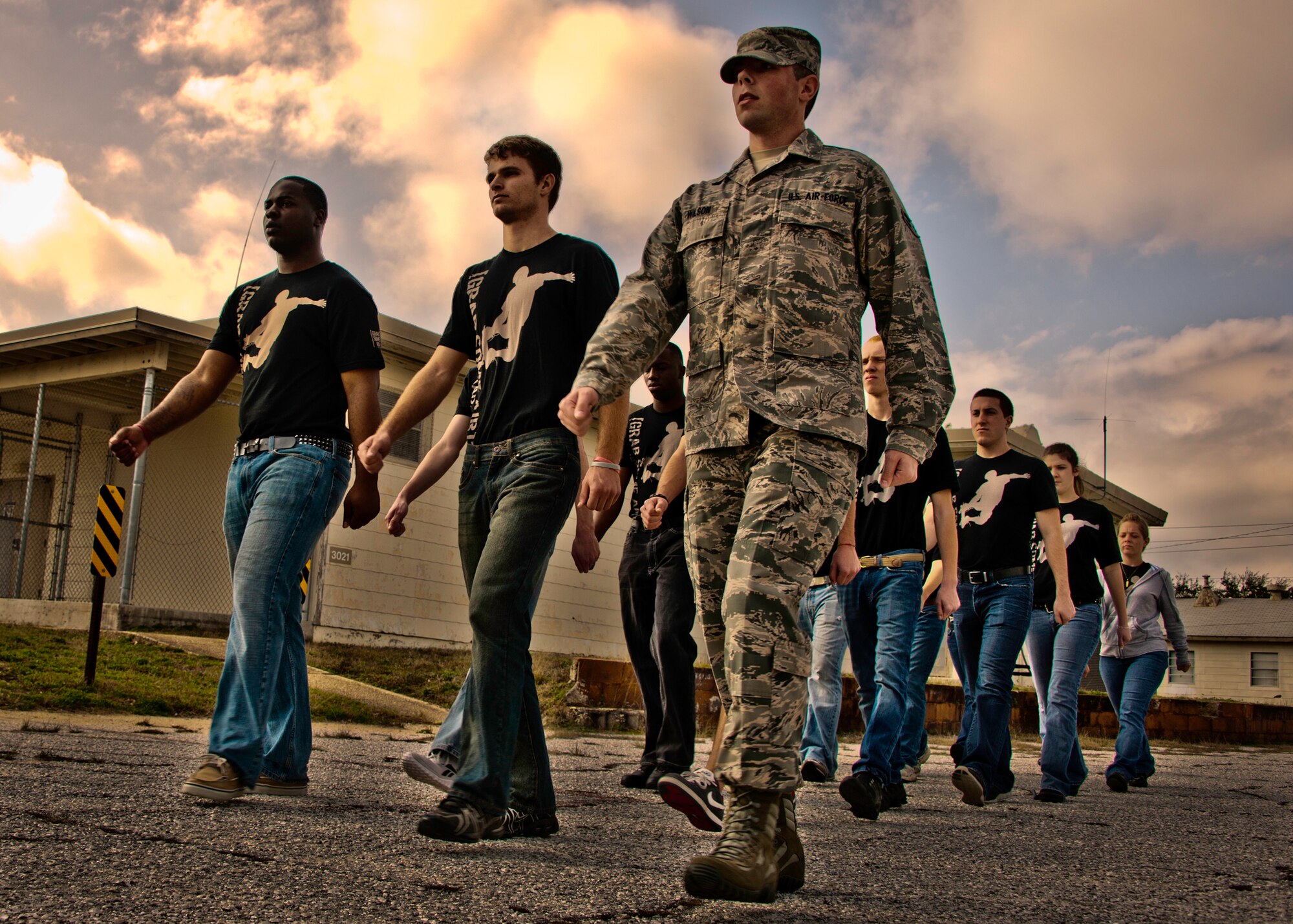 Airman 1st Class John Wilson, of the 919th Special Operations Wing, marches with the new Air Force Reserve recruits, who are learning to drill at Duke Field, Fla., Feb. 5.  This six-month-old introductory training is a new Air Force Reserve Command program to help recruits prepare for military life prior to going to basic military training.  (U.S. Air Force photo/Tech. Sgt. Samuel King Jr.)