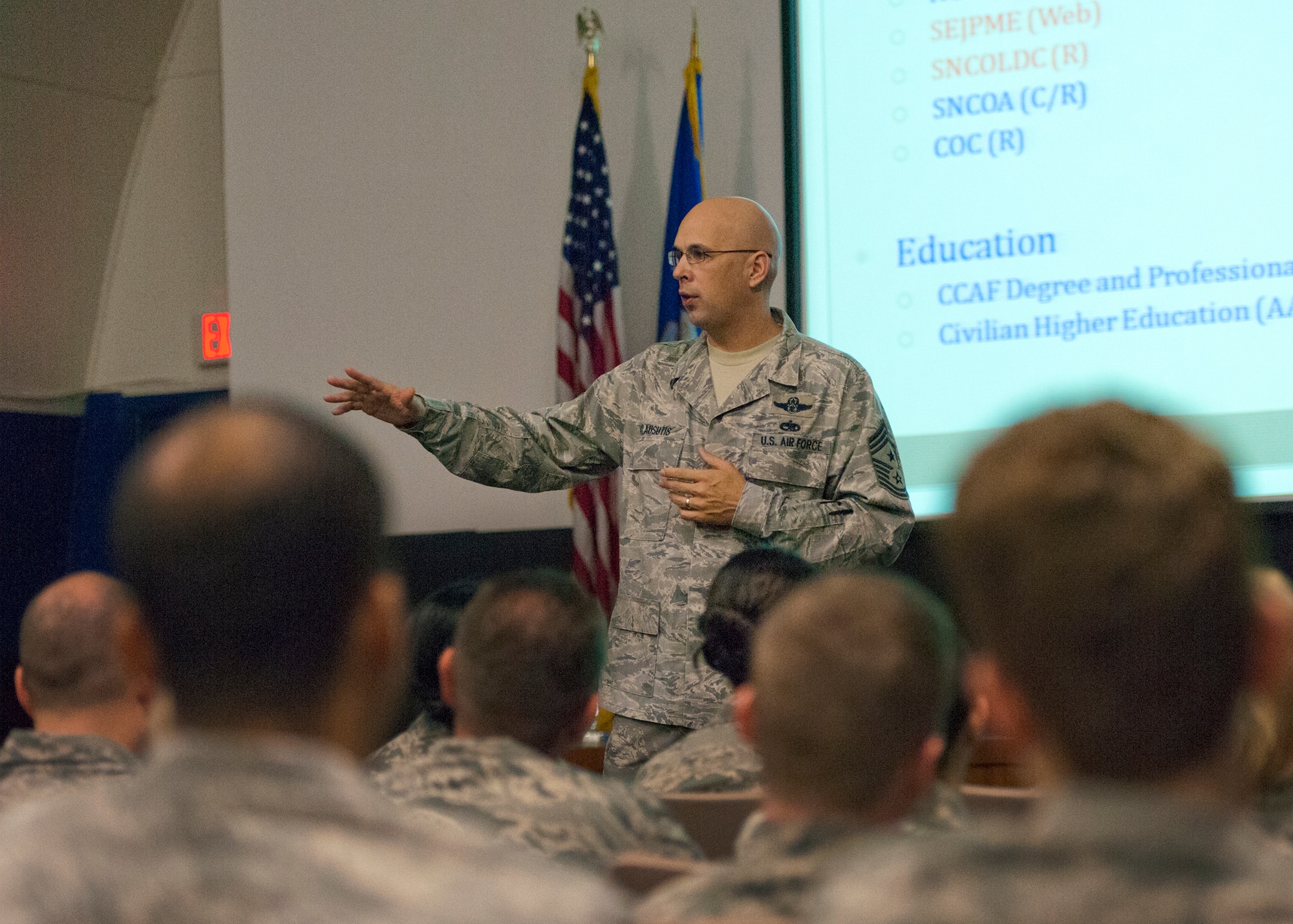 Chief Master Sgt. Michael Klausutis, the 919th Special Operations Wing command chief, talks to his Airmen in one of two enlisted calls held at Duke Field during the February unit training assembly.  Topics covered by the chief were the status of the 919th mission and future of the wing, physical training, education and development.  (U.S. Air Force photo/Tech. Sgt. Samuel King Jr.)